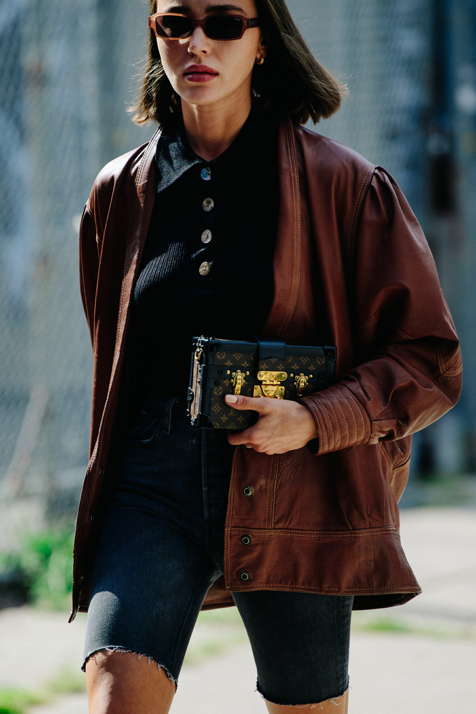 Woman wearing brown leather jacket
