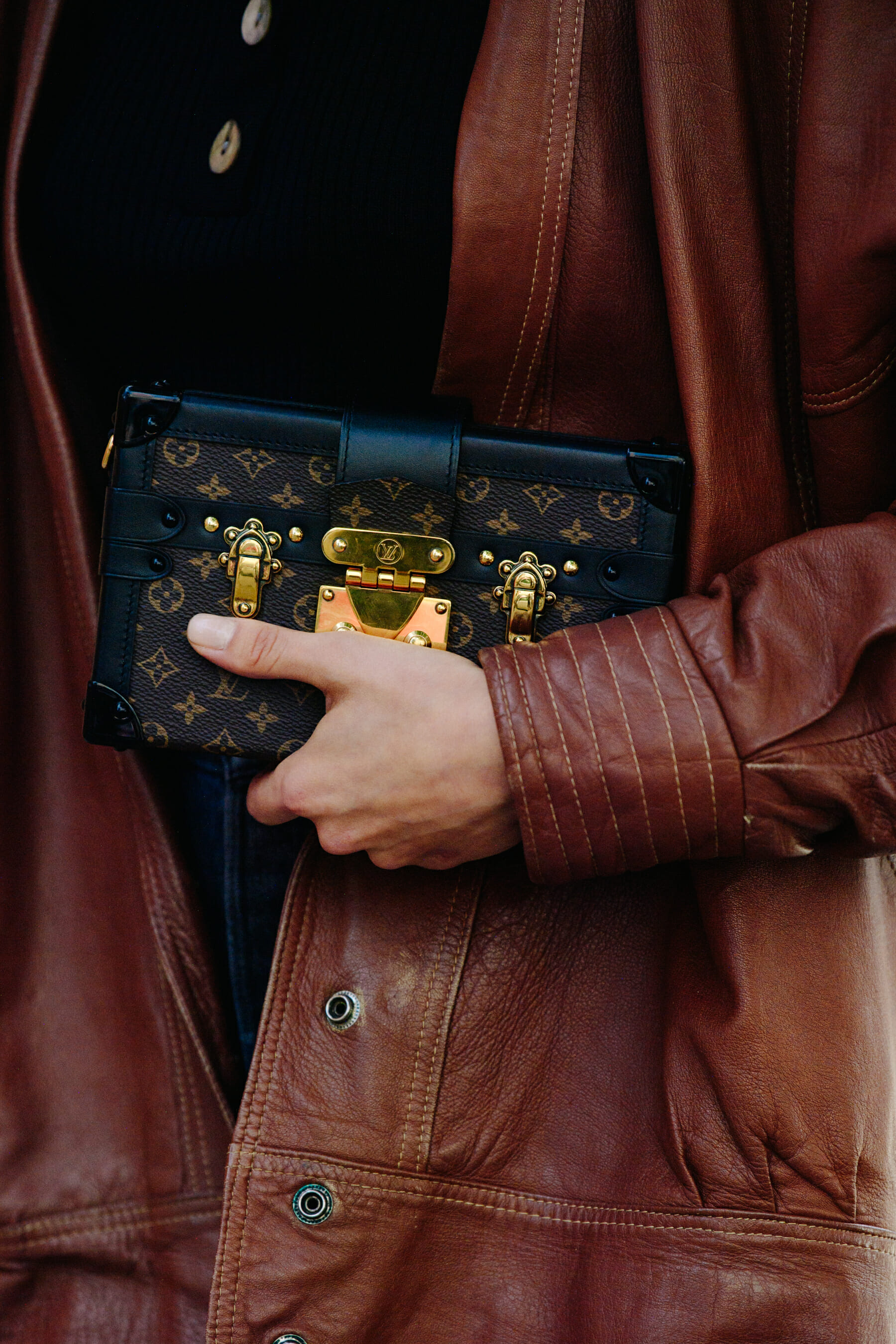 Woman wearing brown leather jacket