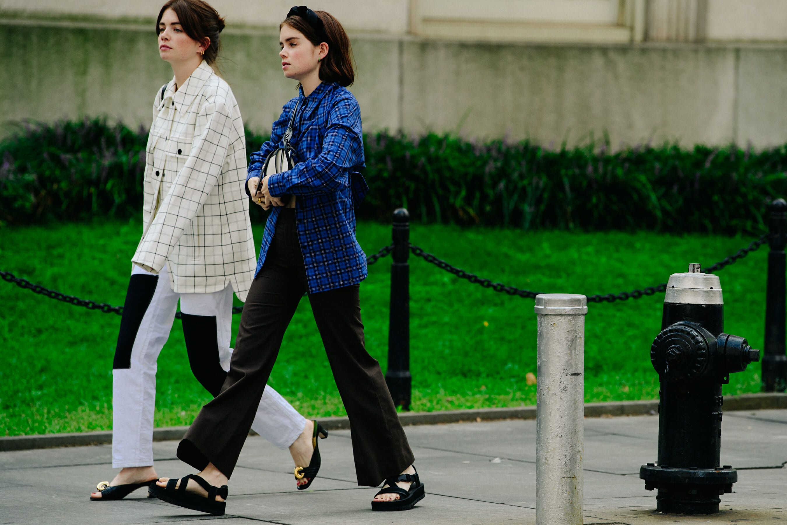 Two women wearing check shirts