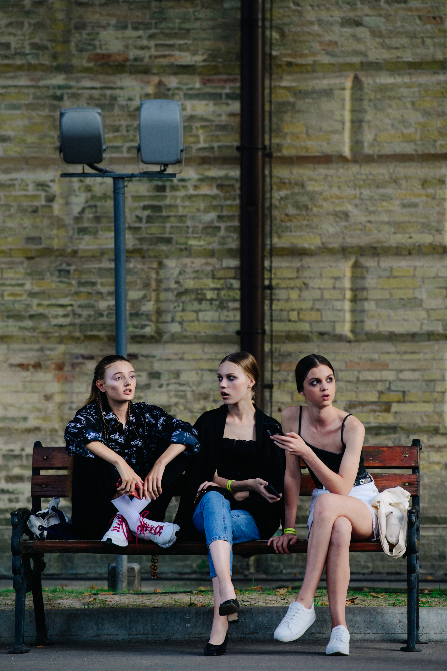 Models sat on bench