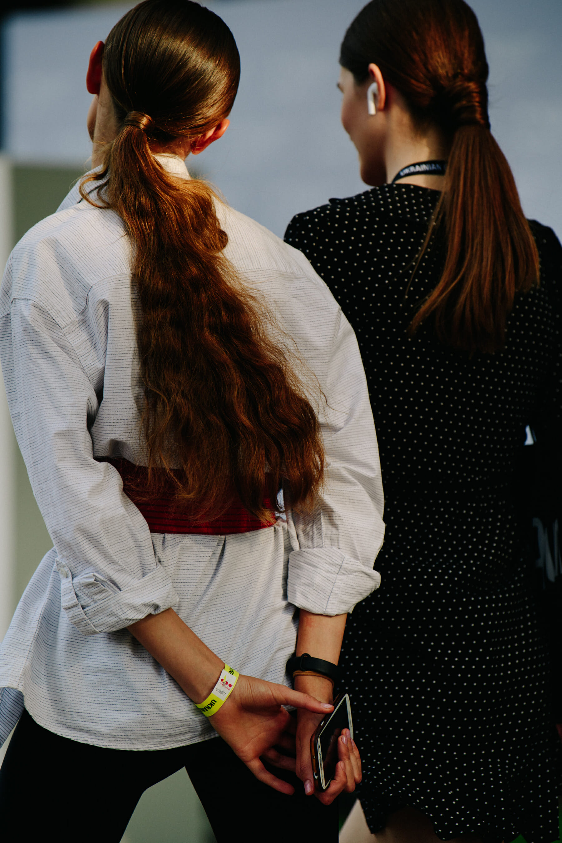Two models wearing white and black