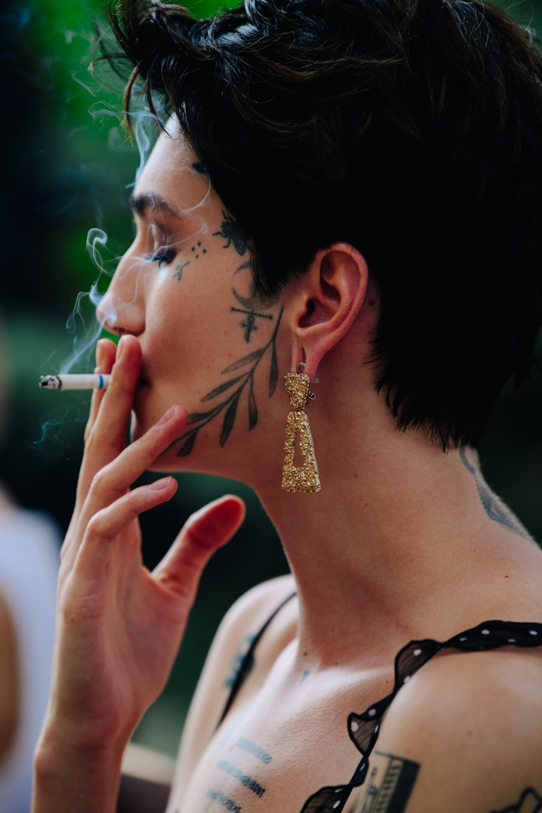 Woman with tattooed face