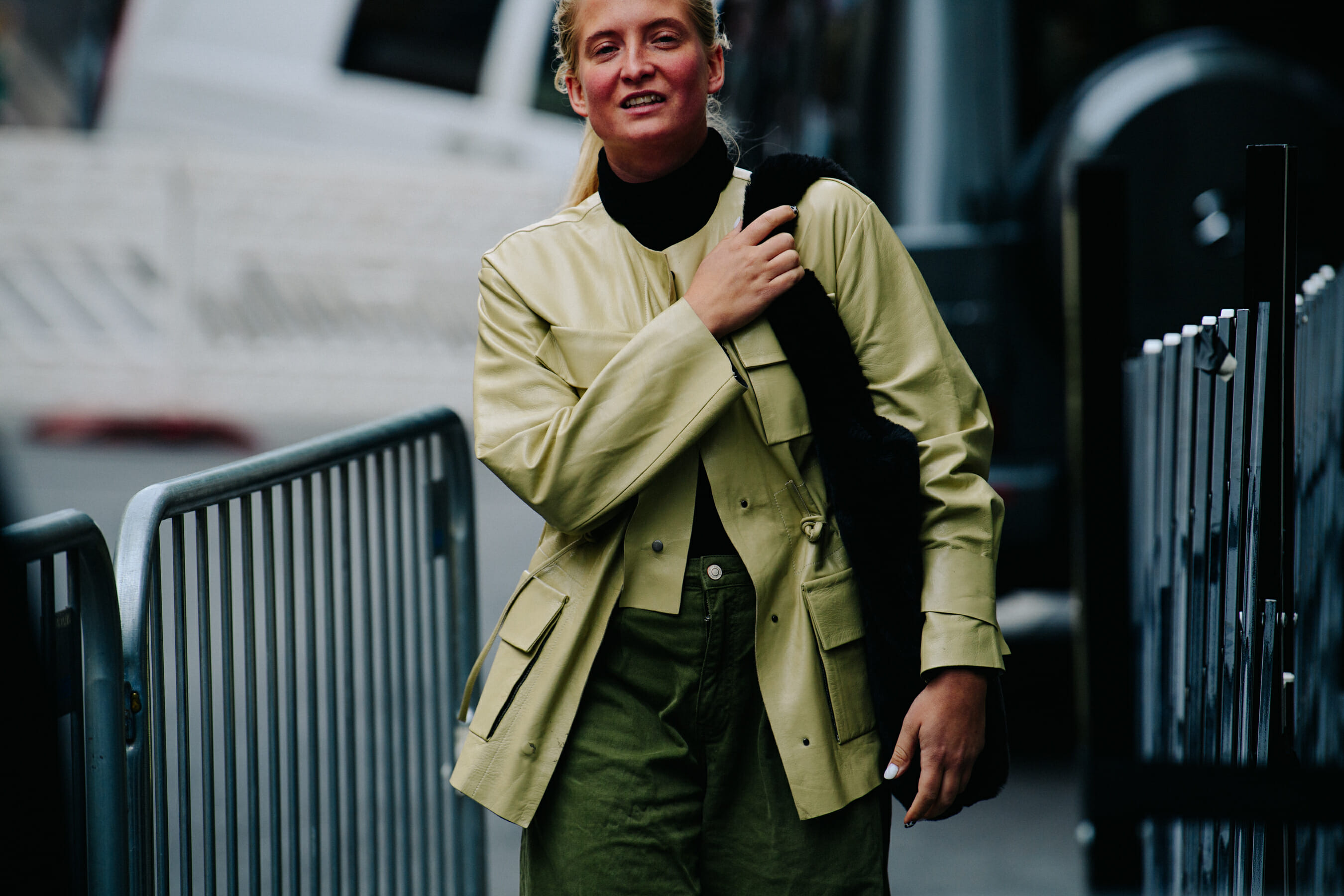 Woman wearing green leather jacket