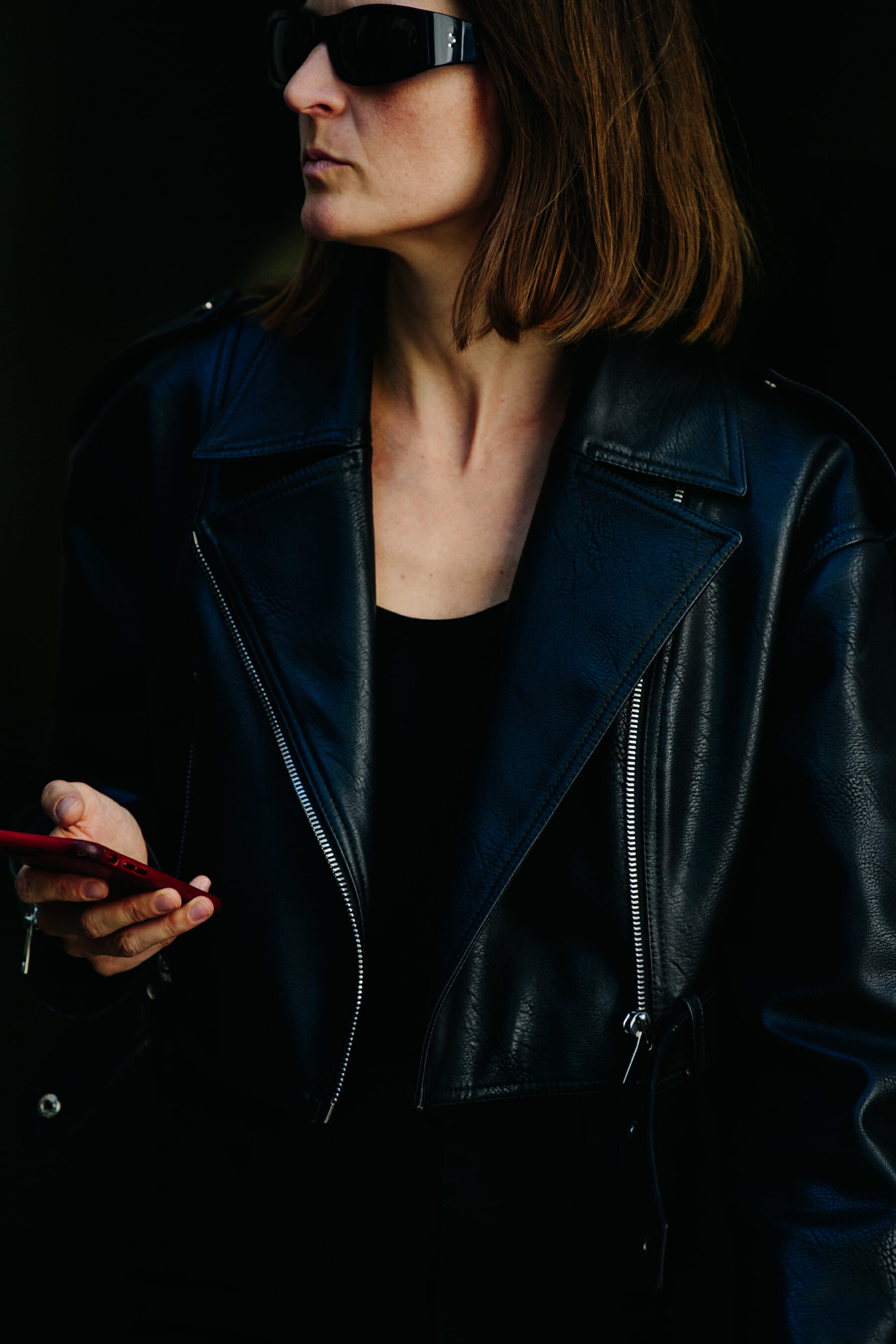 Woman wearing black leather jacket