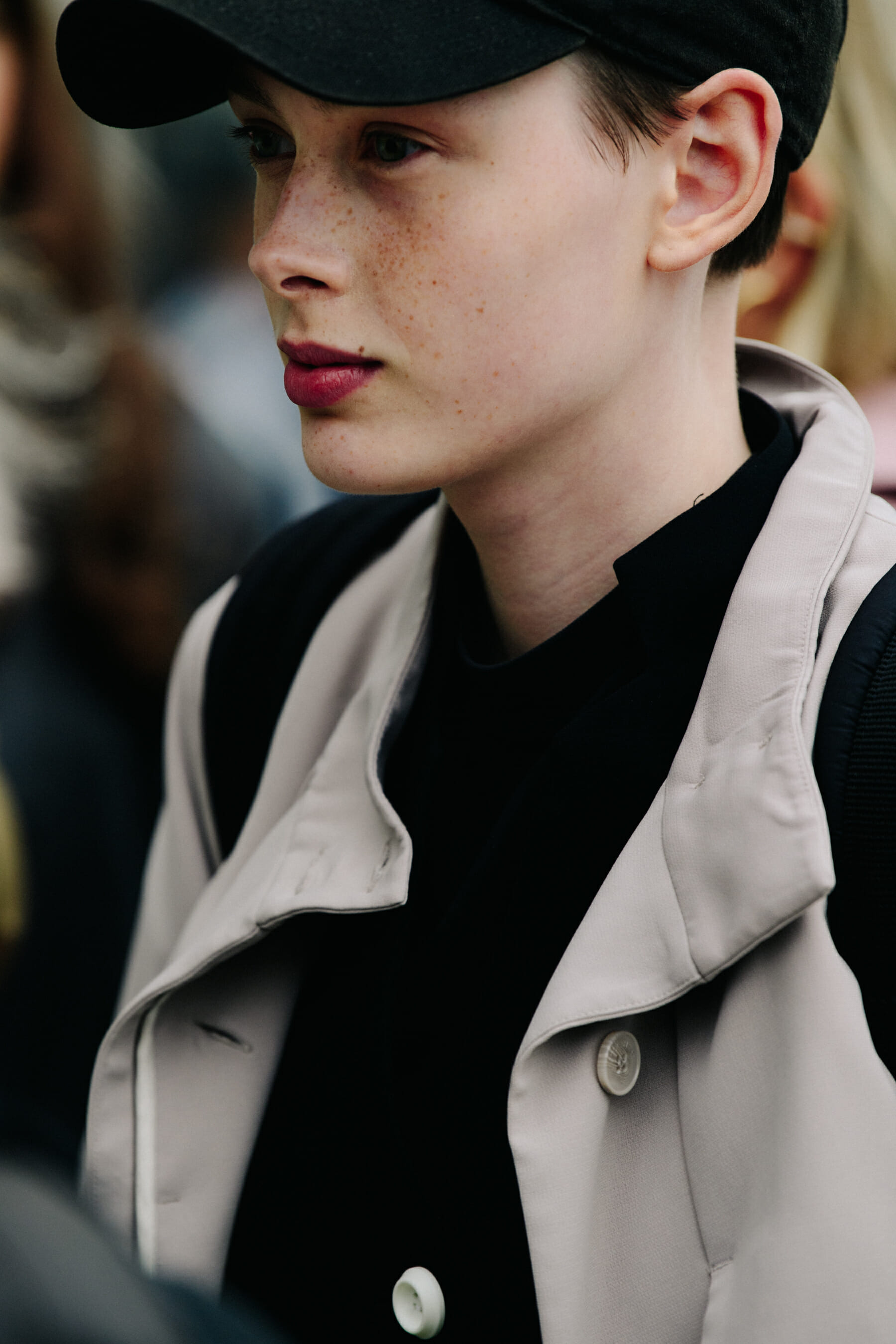 Model wearing black cap