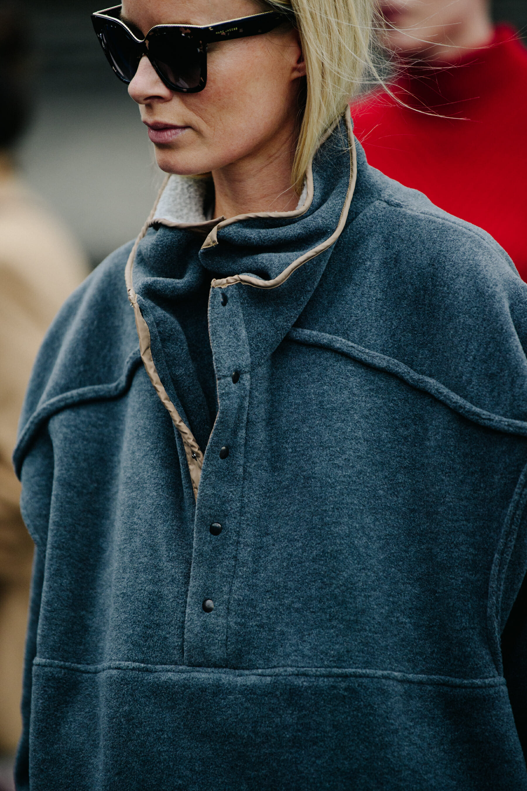 Woman wearing grey jumper