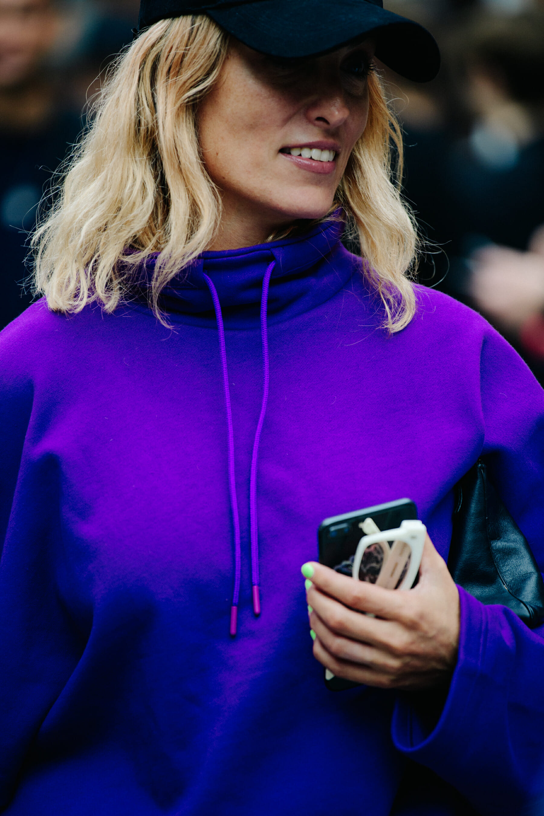 Woman wearing purple hoodie