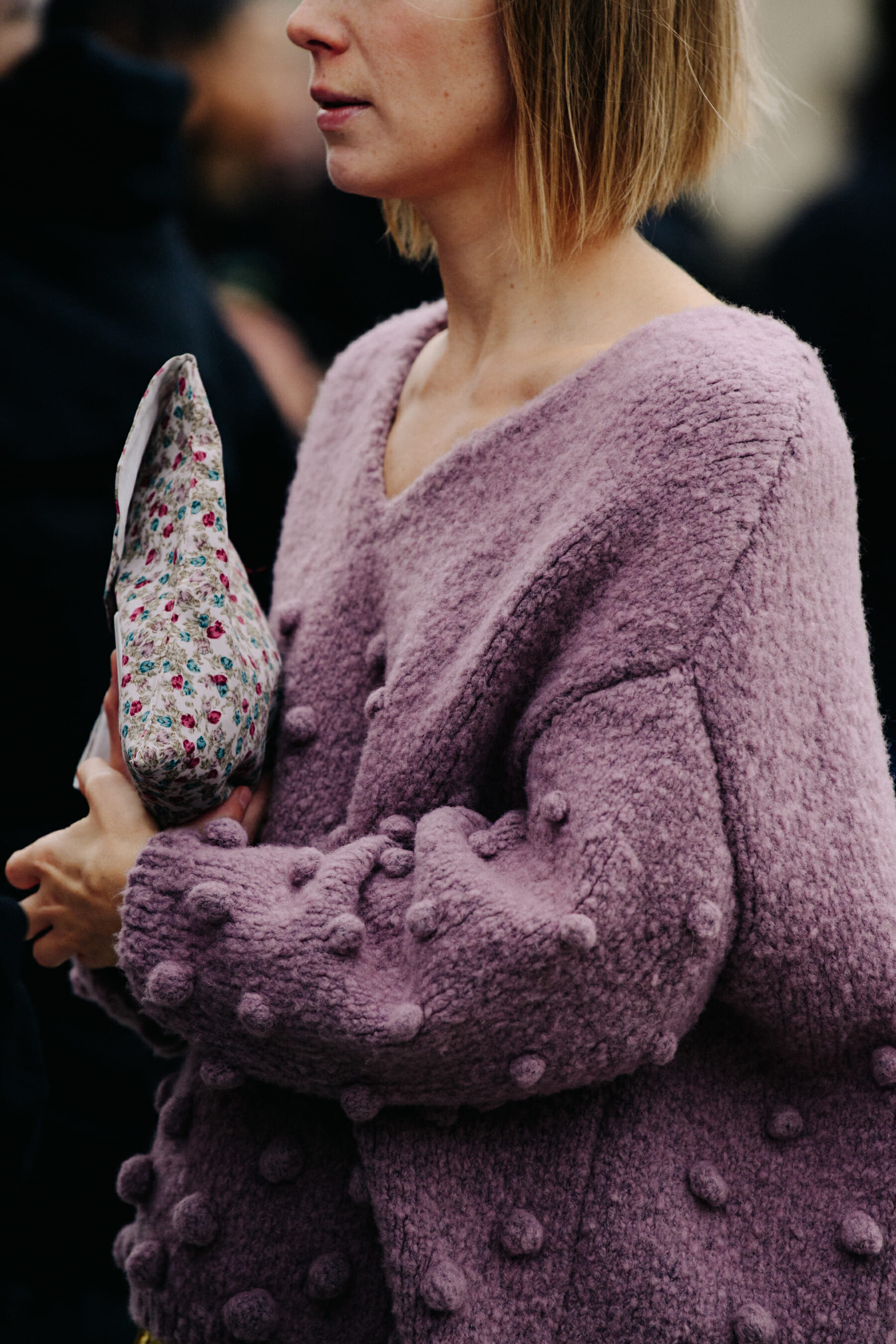 Woman wearing purple wool jumper