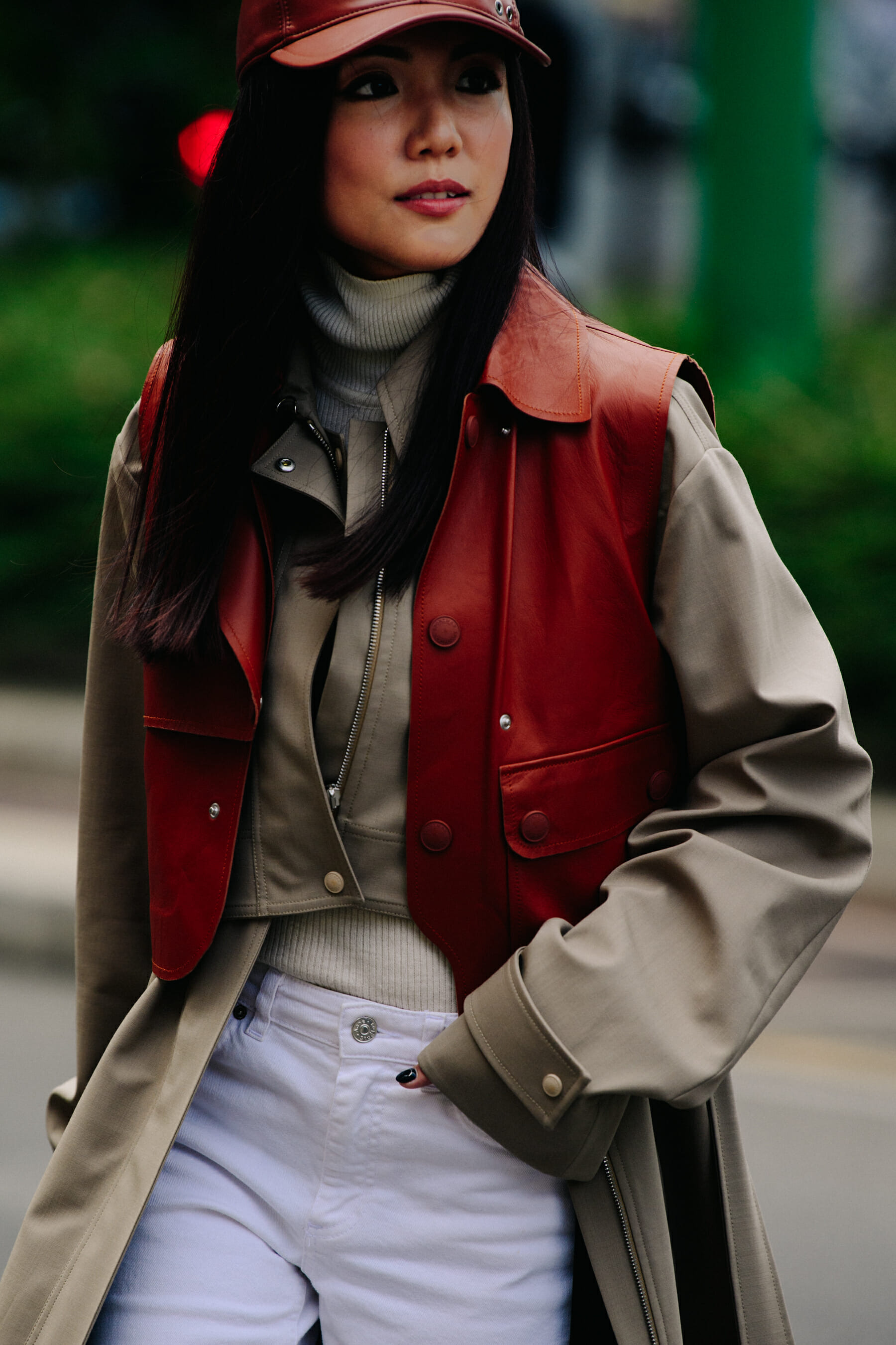 Woman wearing brown cap and vest