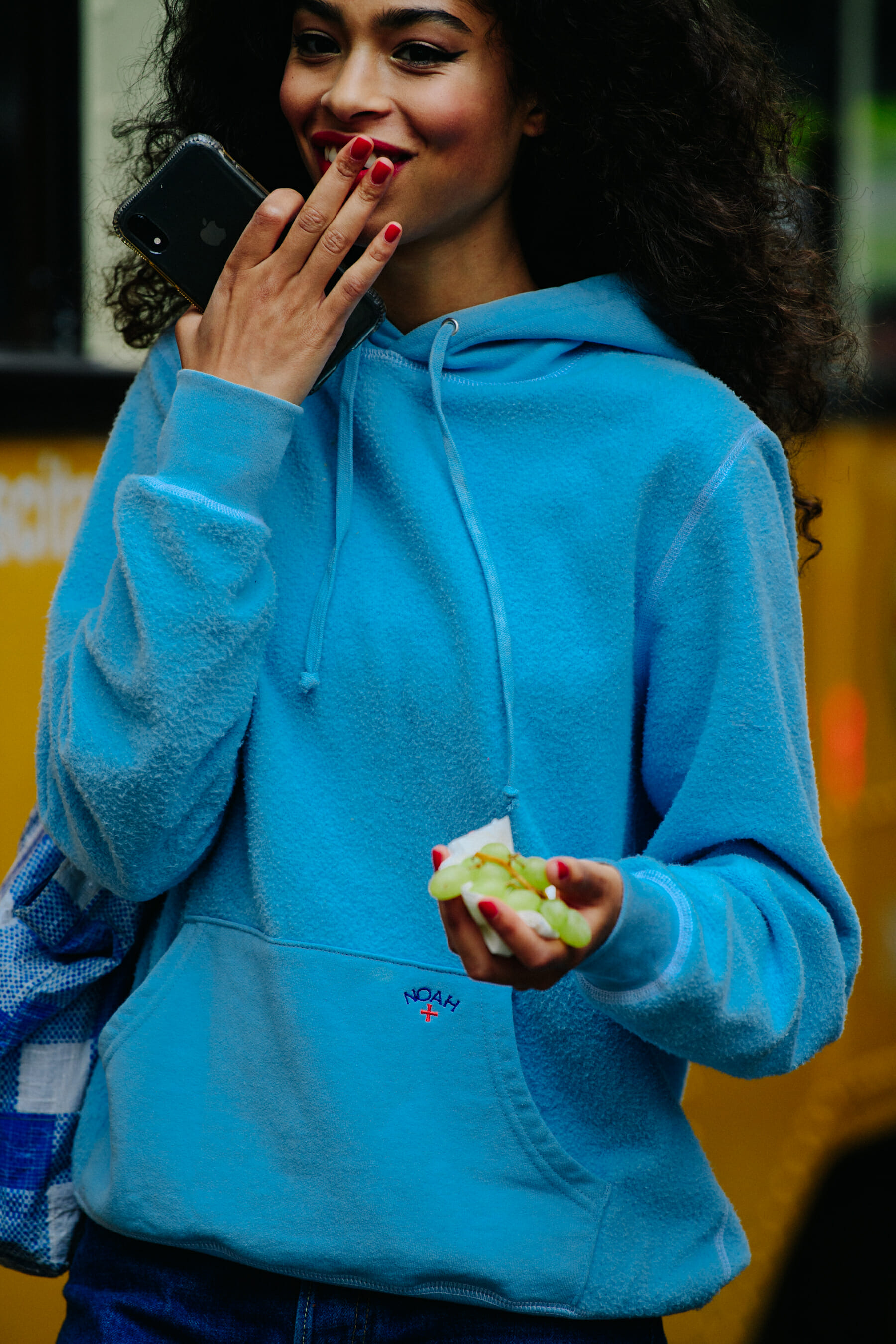 Model wearing blue Noah hoodie