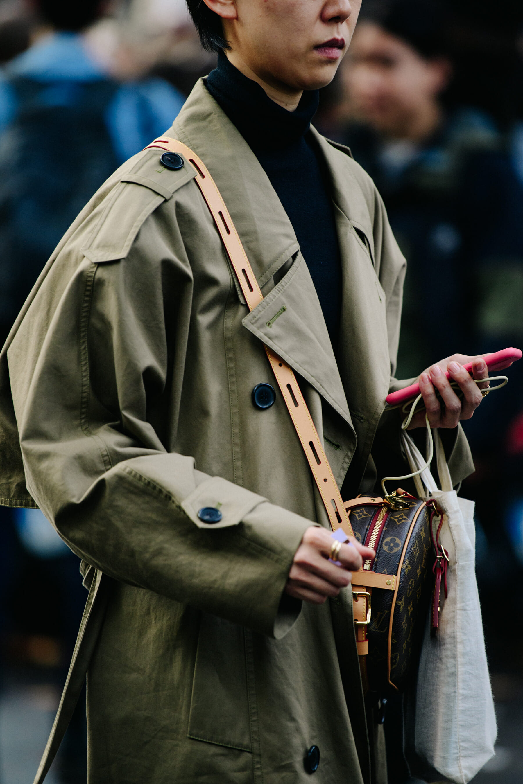Woman wearing Louis Vuitton bag