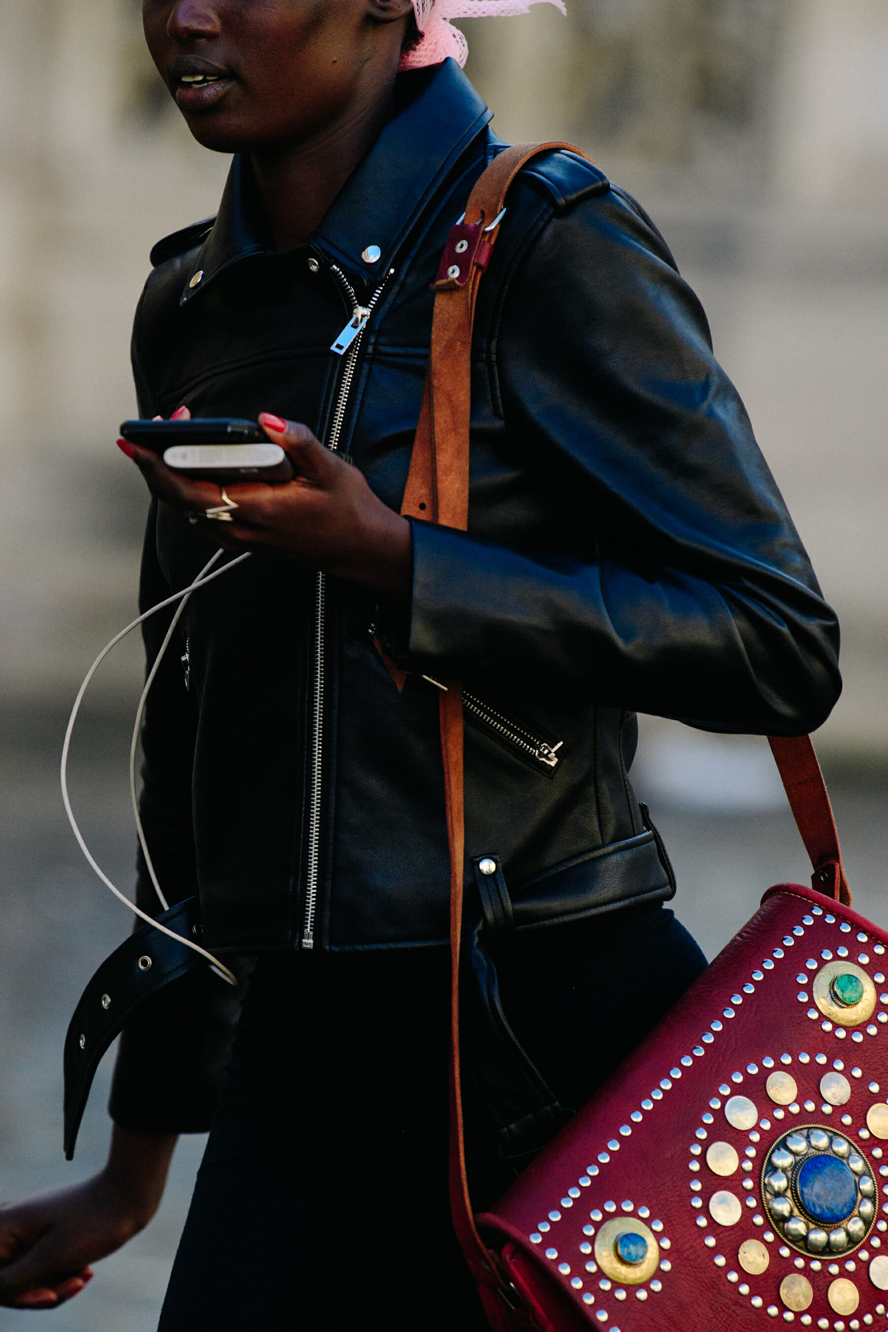 Model carrying red bag