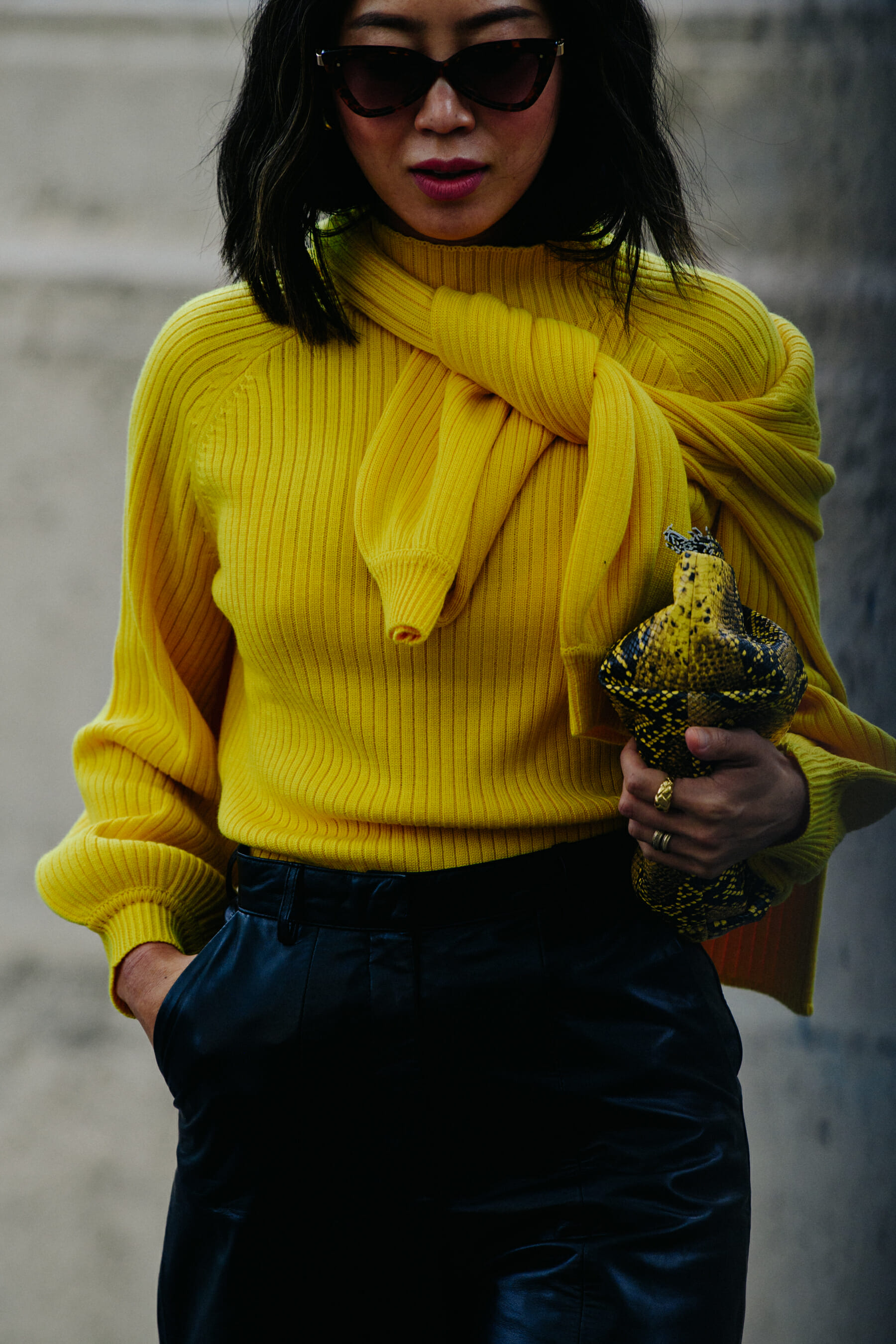 Woman wearing yellow jumper