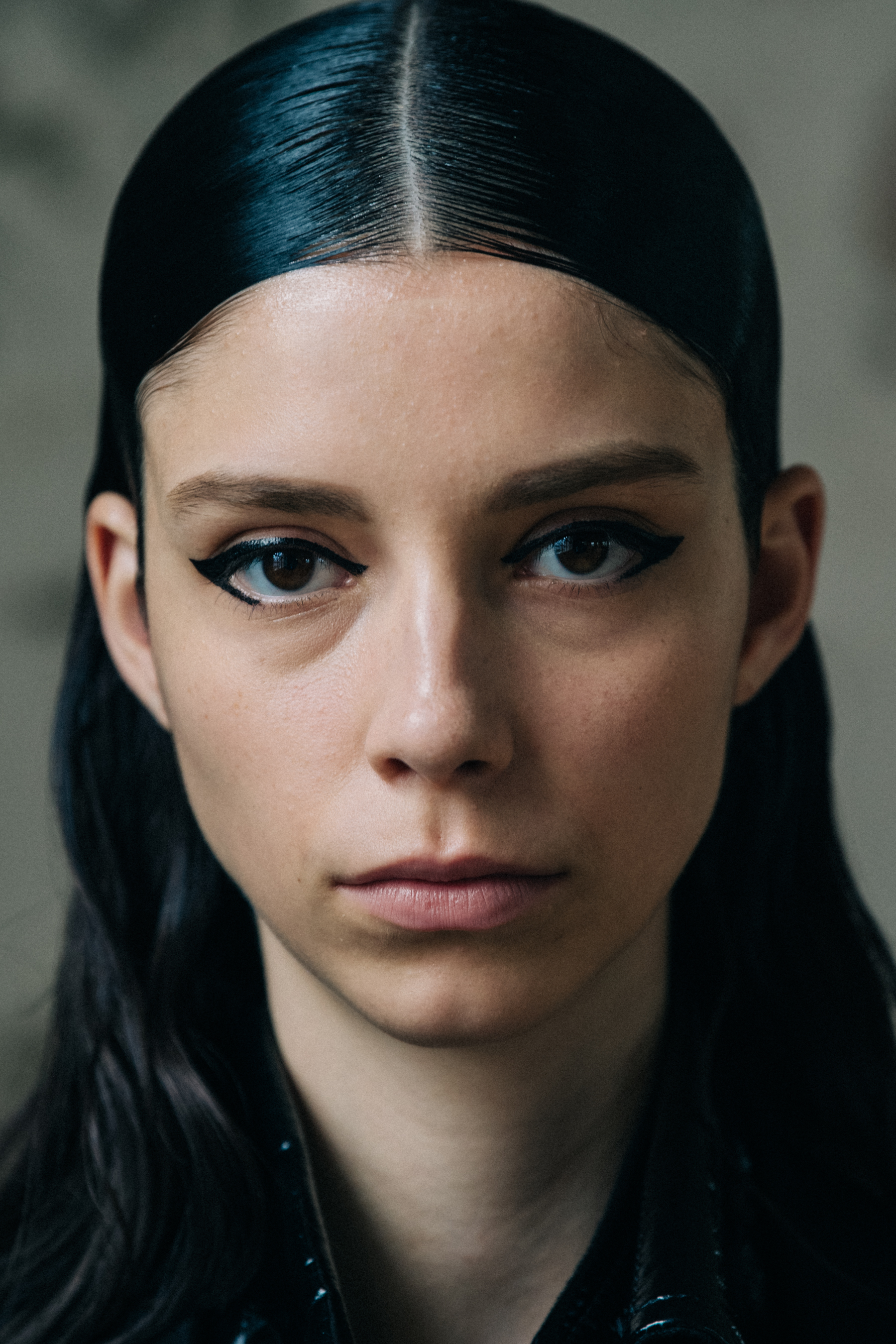 Portrait of model wearing dark eye makeup