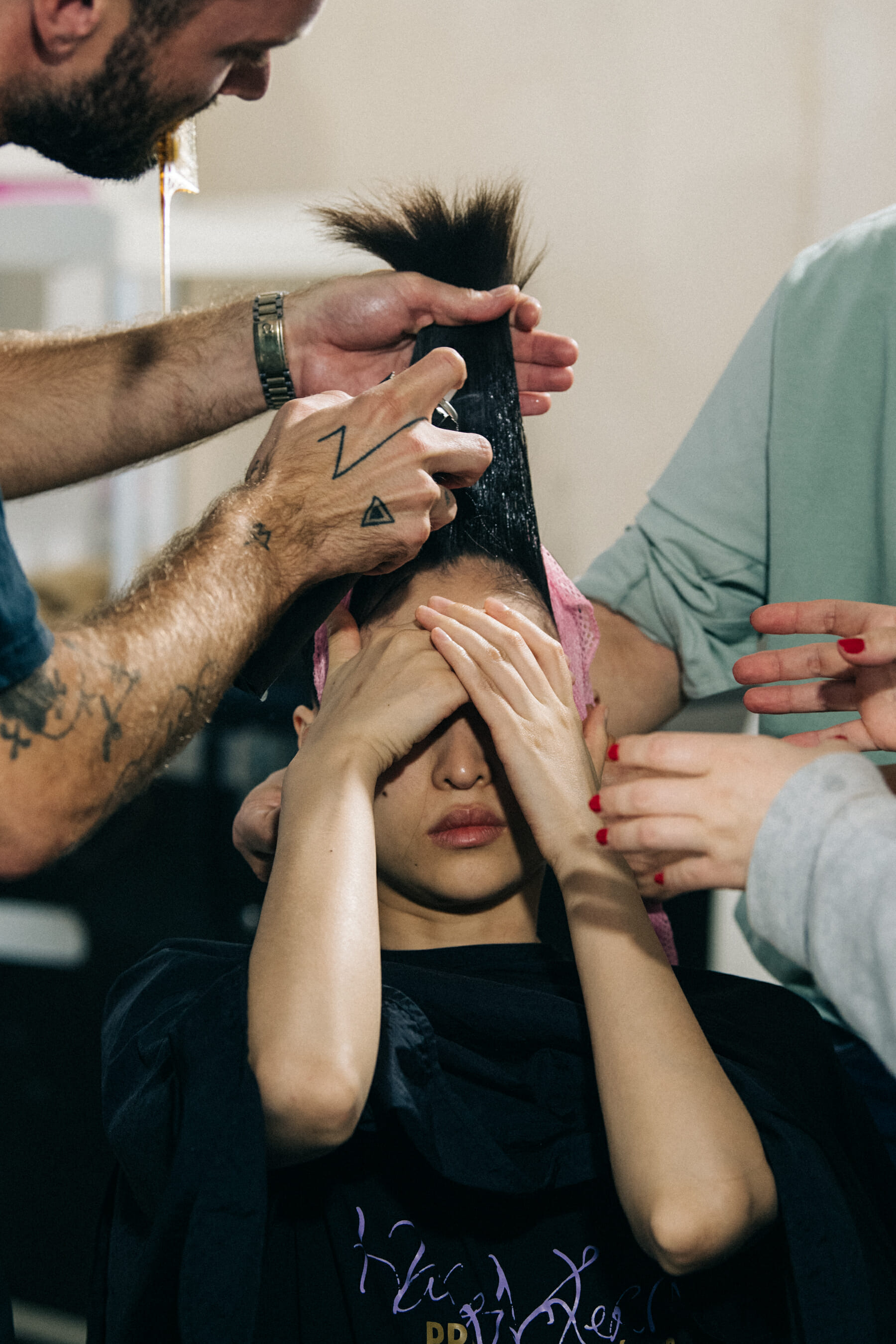 Model in hair and makeup backstage