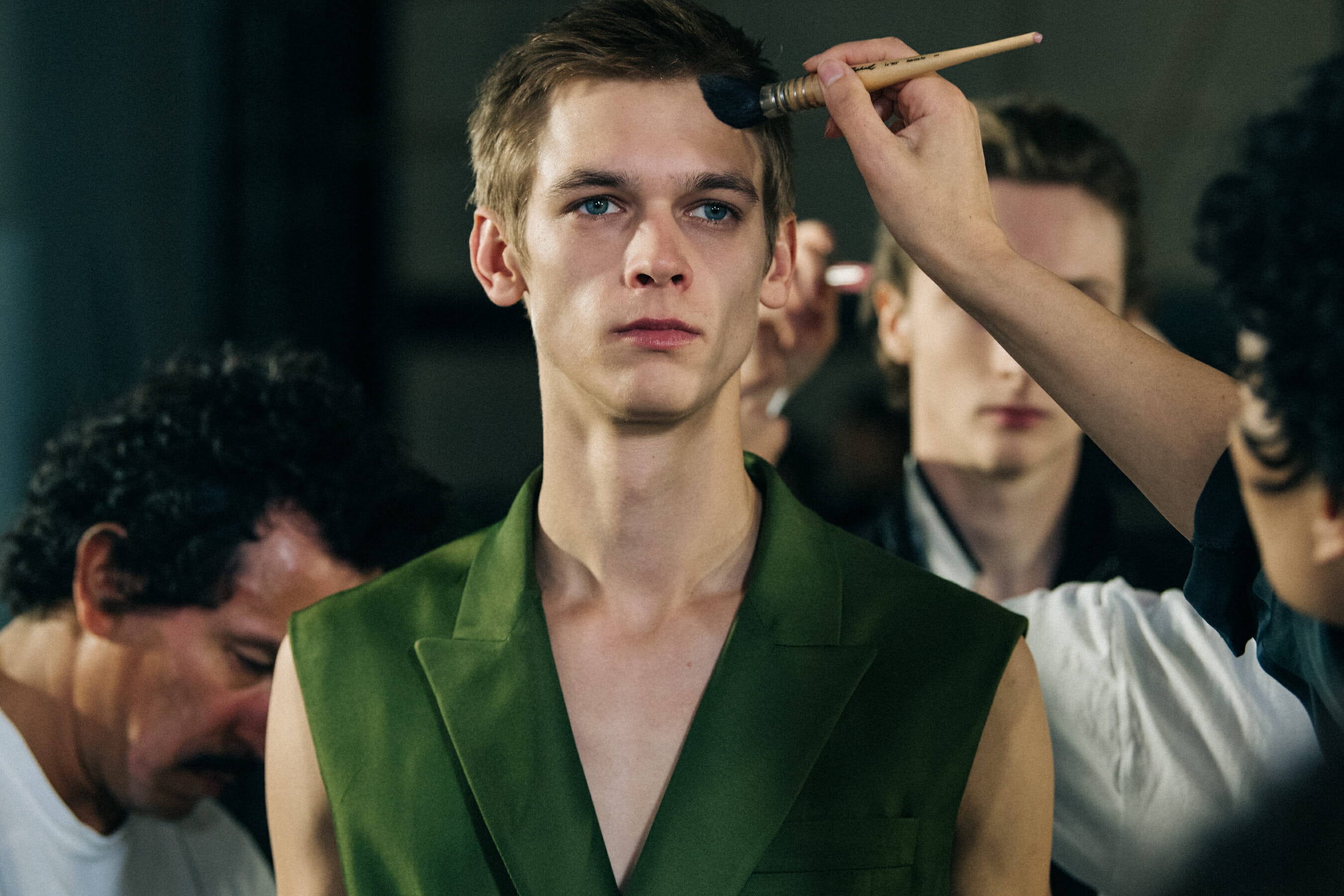 Model wearing green outfit at Haider Ackermann