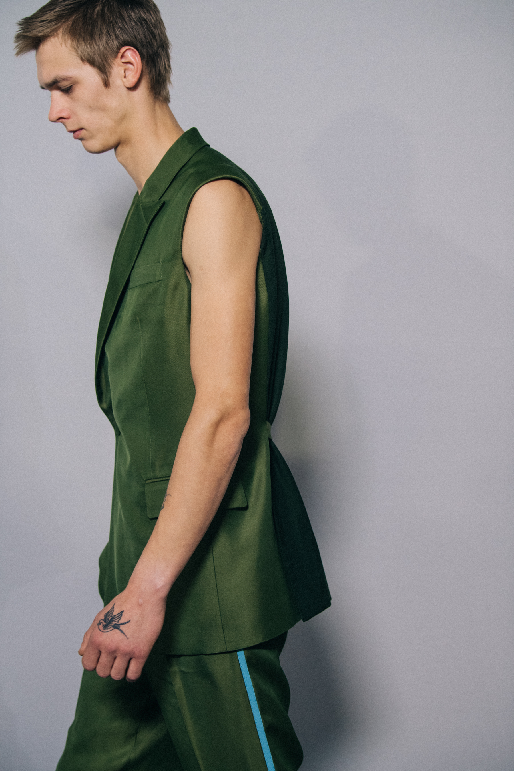 Model wearing green outfit at Haider Ackermann