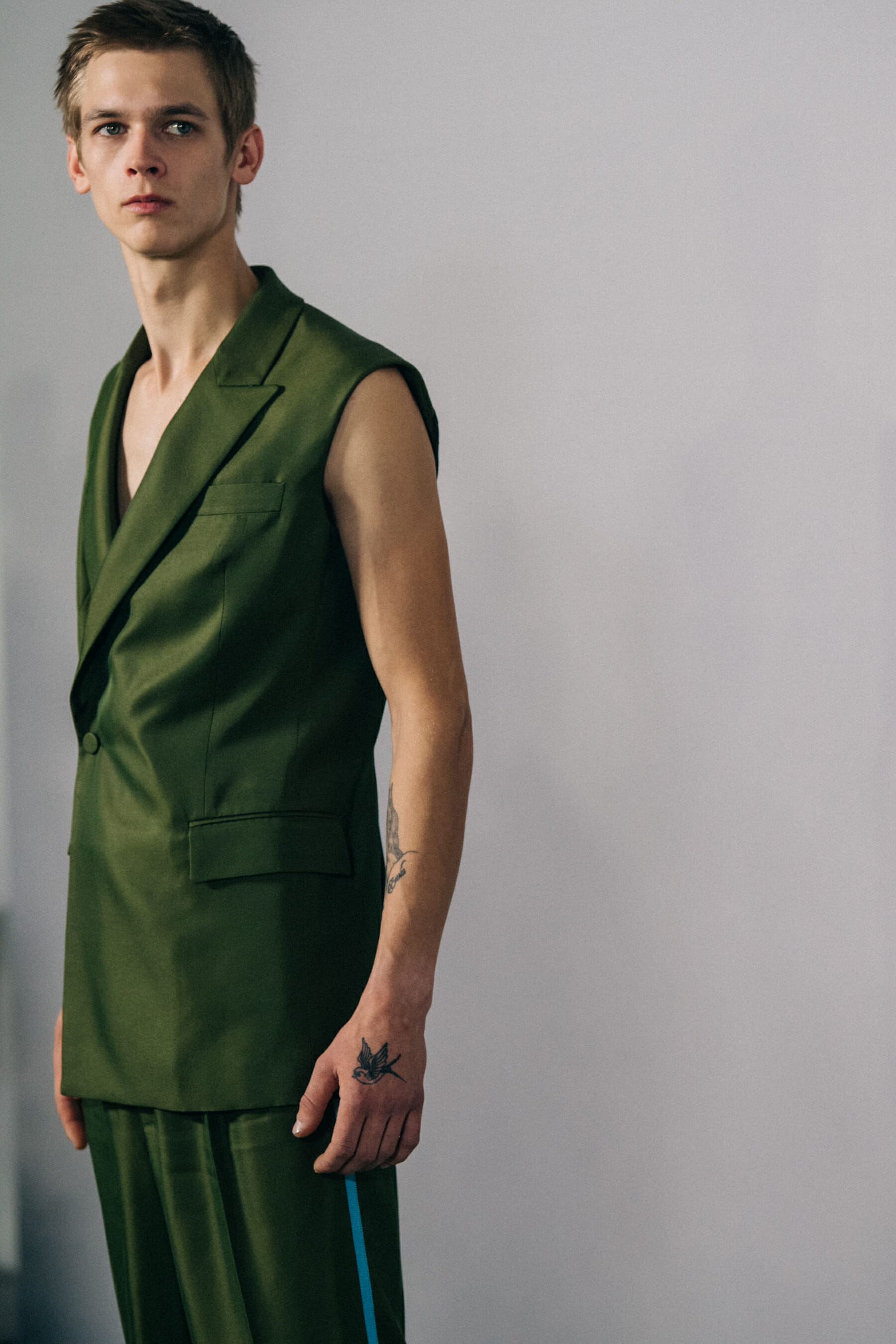 Model wearing green outfit at Haider Ackermann