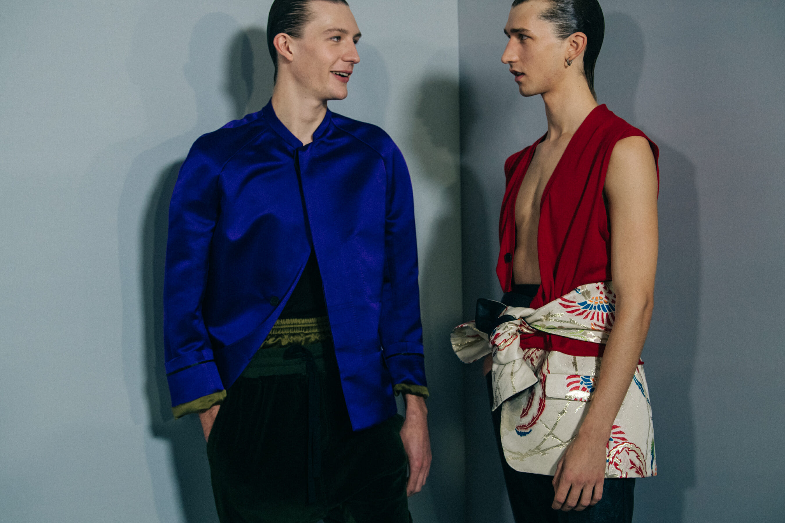Model wearing blue shirt backstage