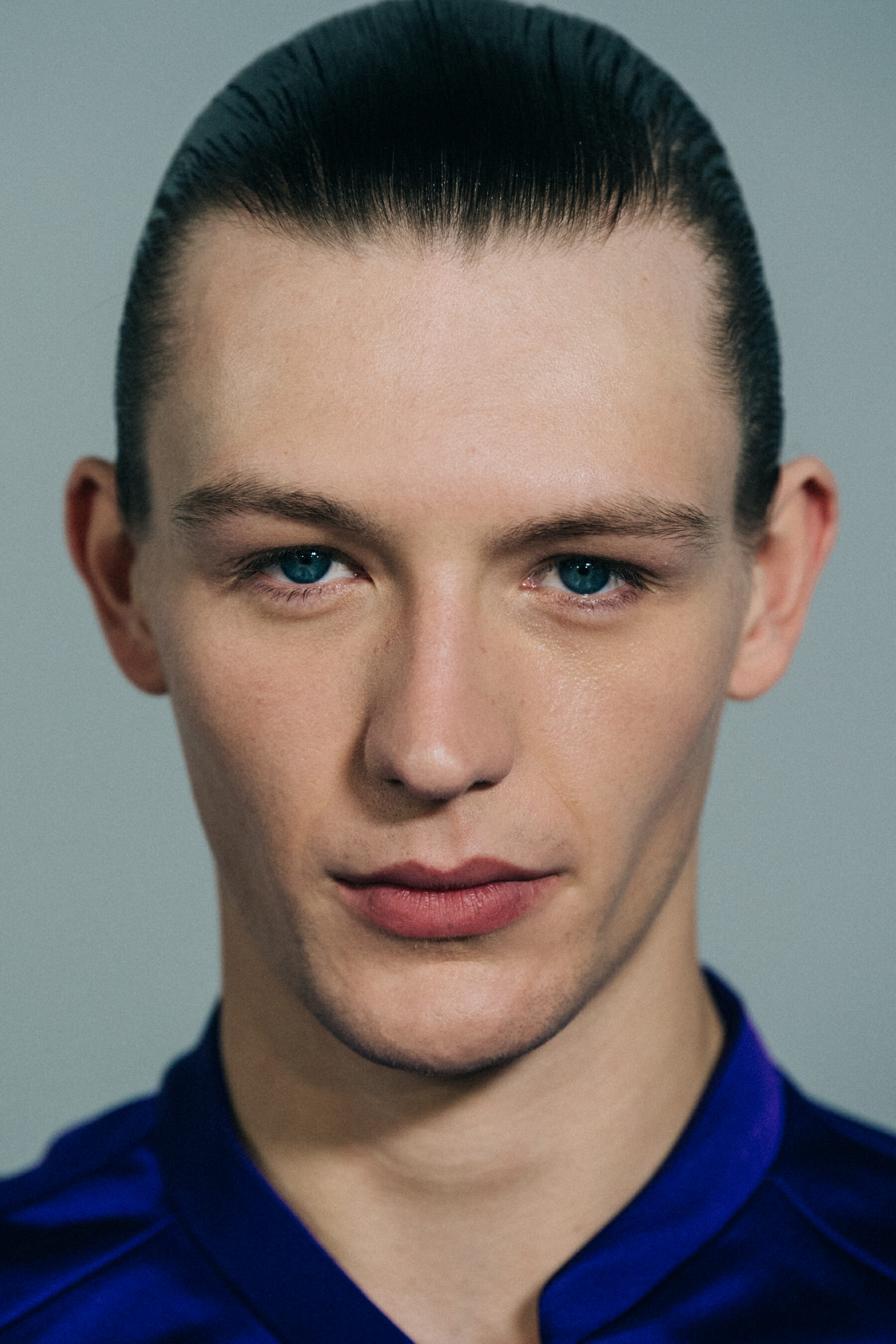 Model wearing blue shirt backstage