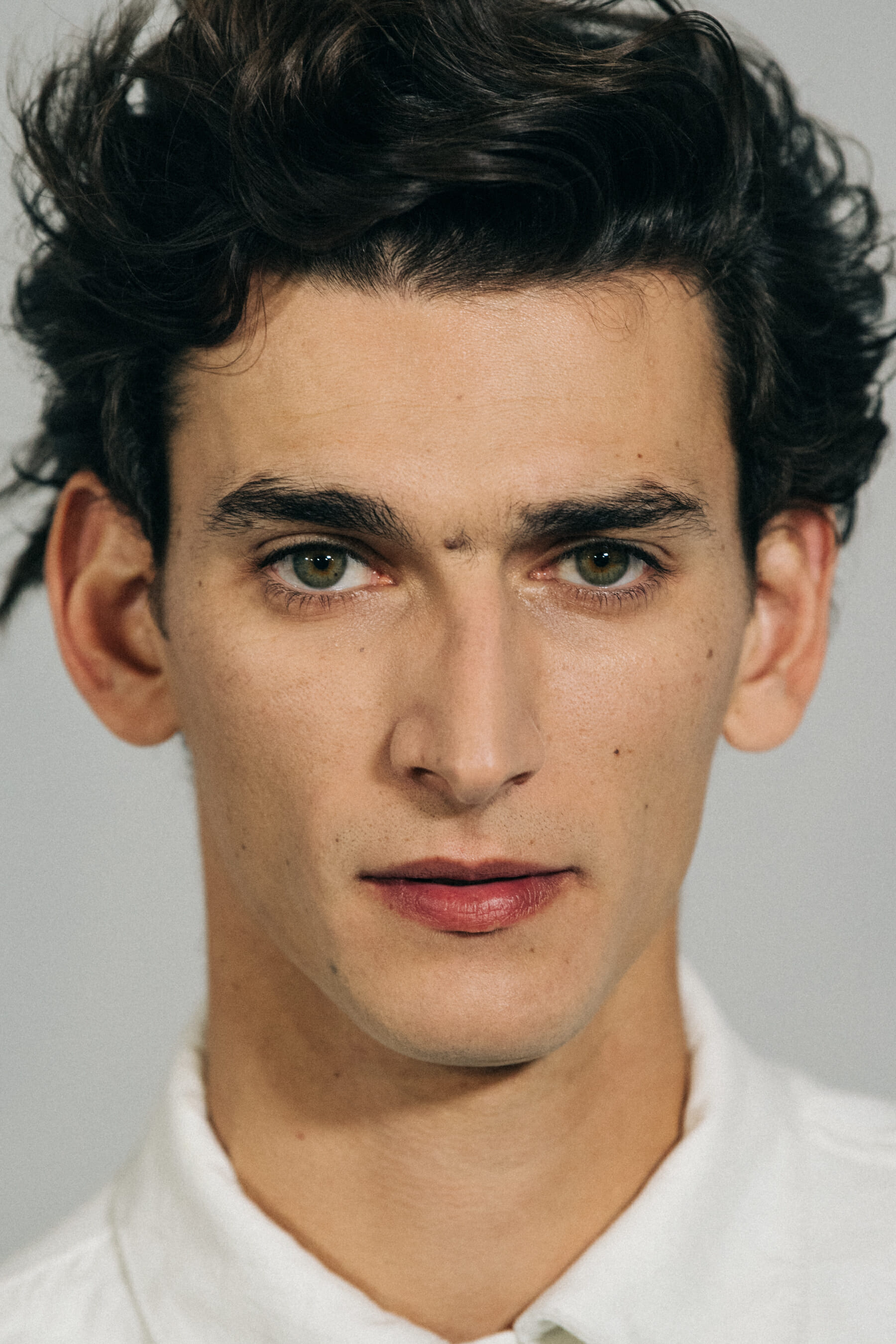 Model with large eyebrows at Haider Ackermann