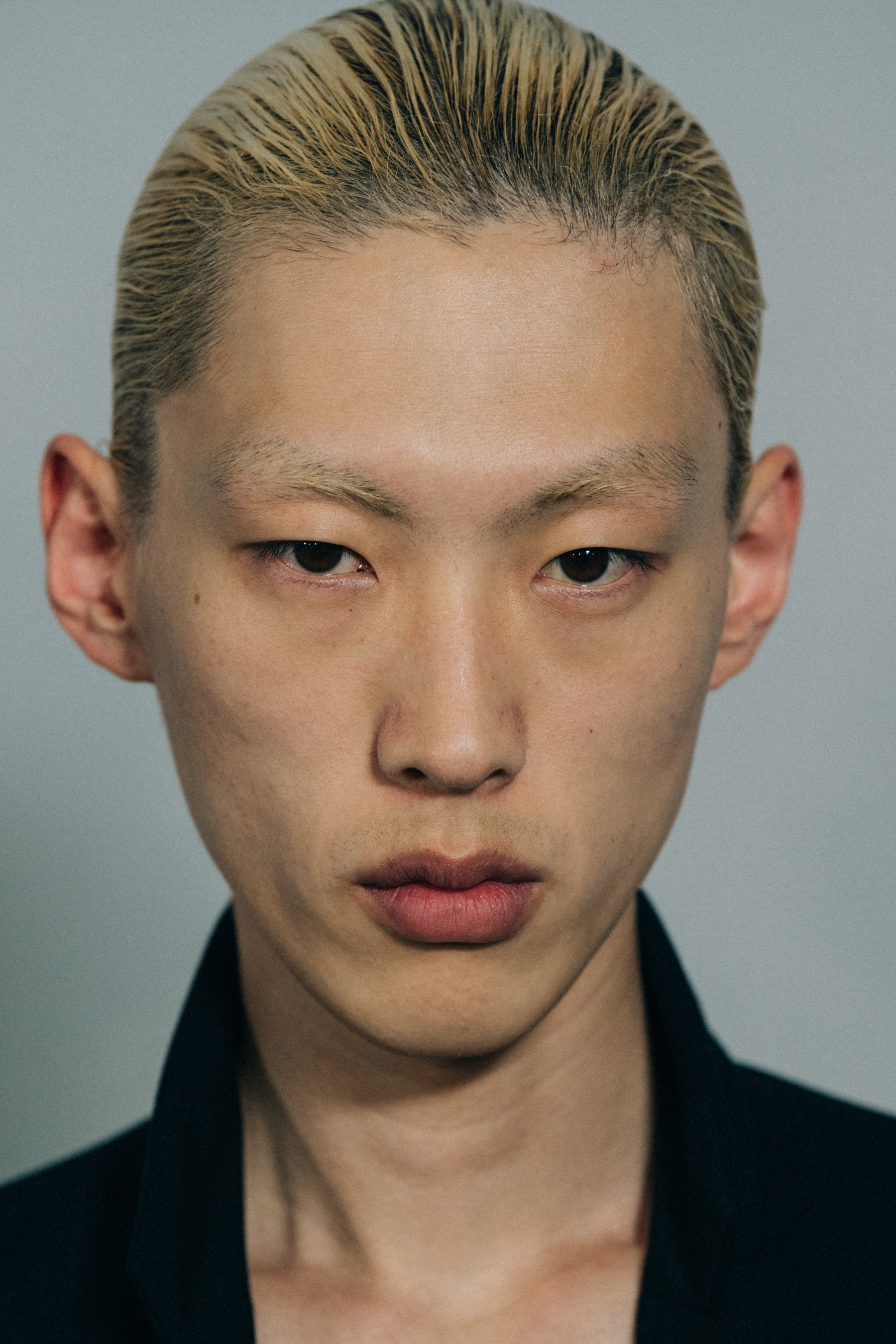 Model with large eyebrows at Haider Ackermann