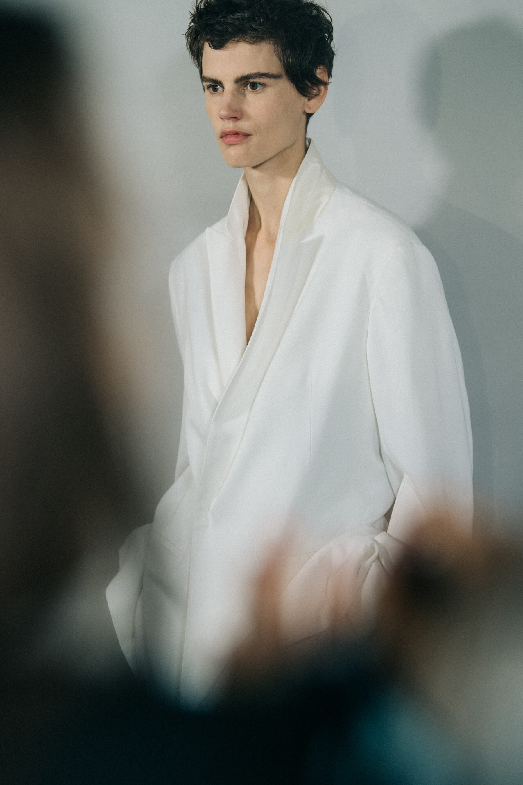 Model wearing white outfit at Haider Ackermann