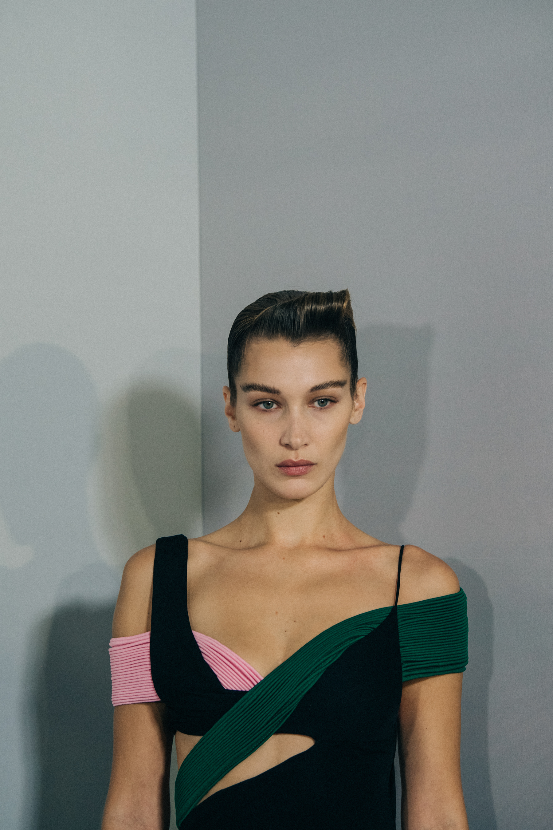 Model backstage wearing green dress