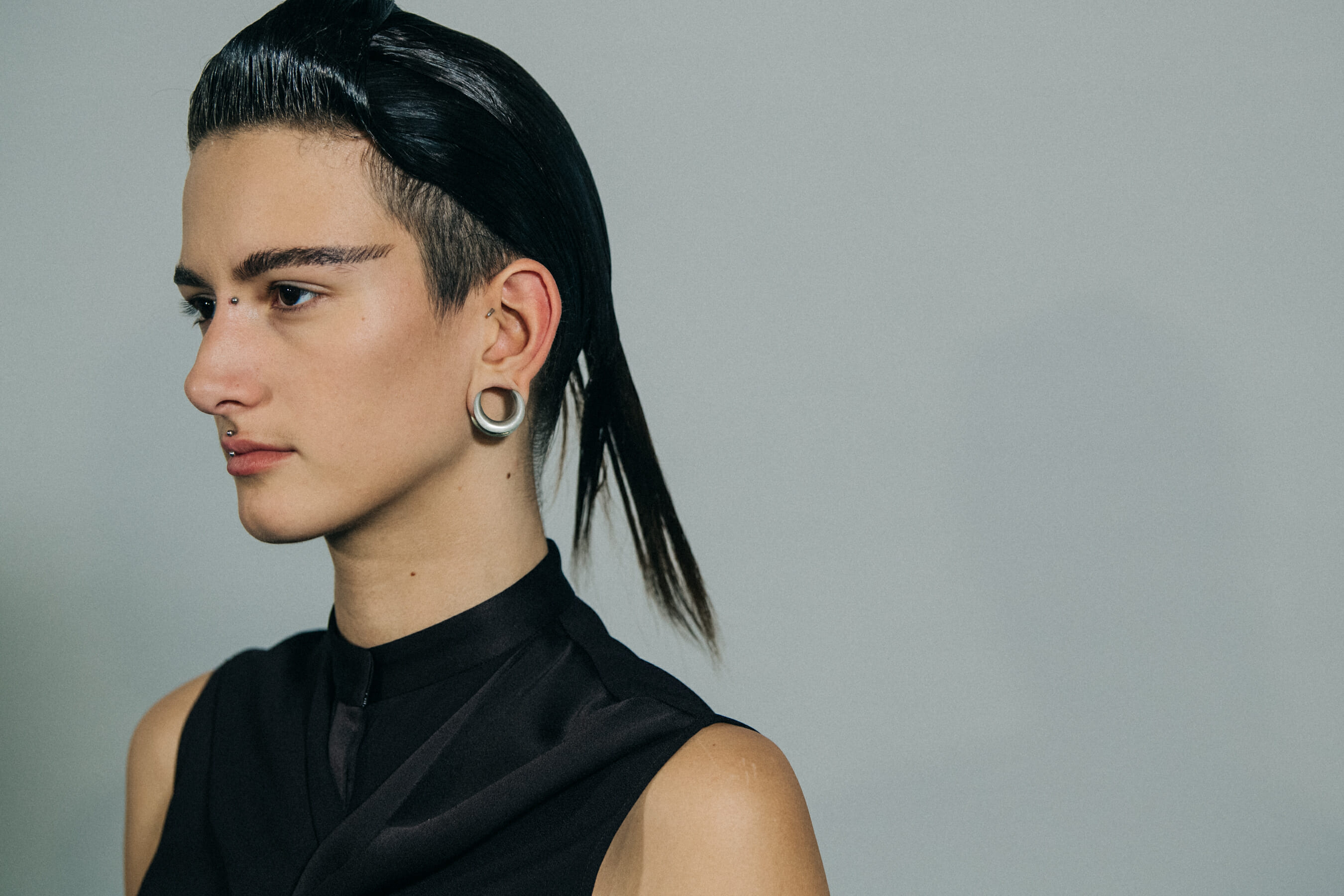 Model wearing black vest at Haider Ackermann