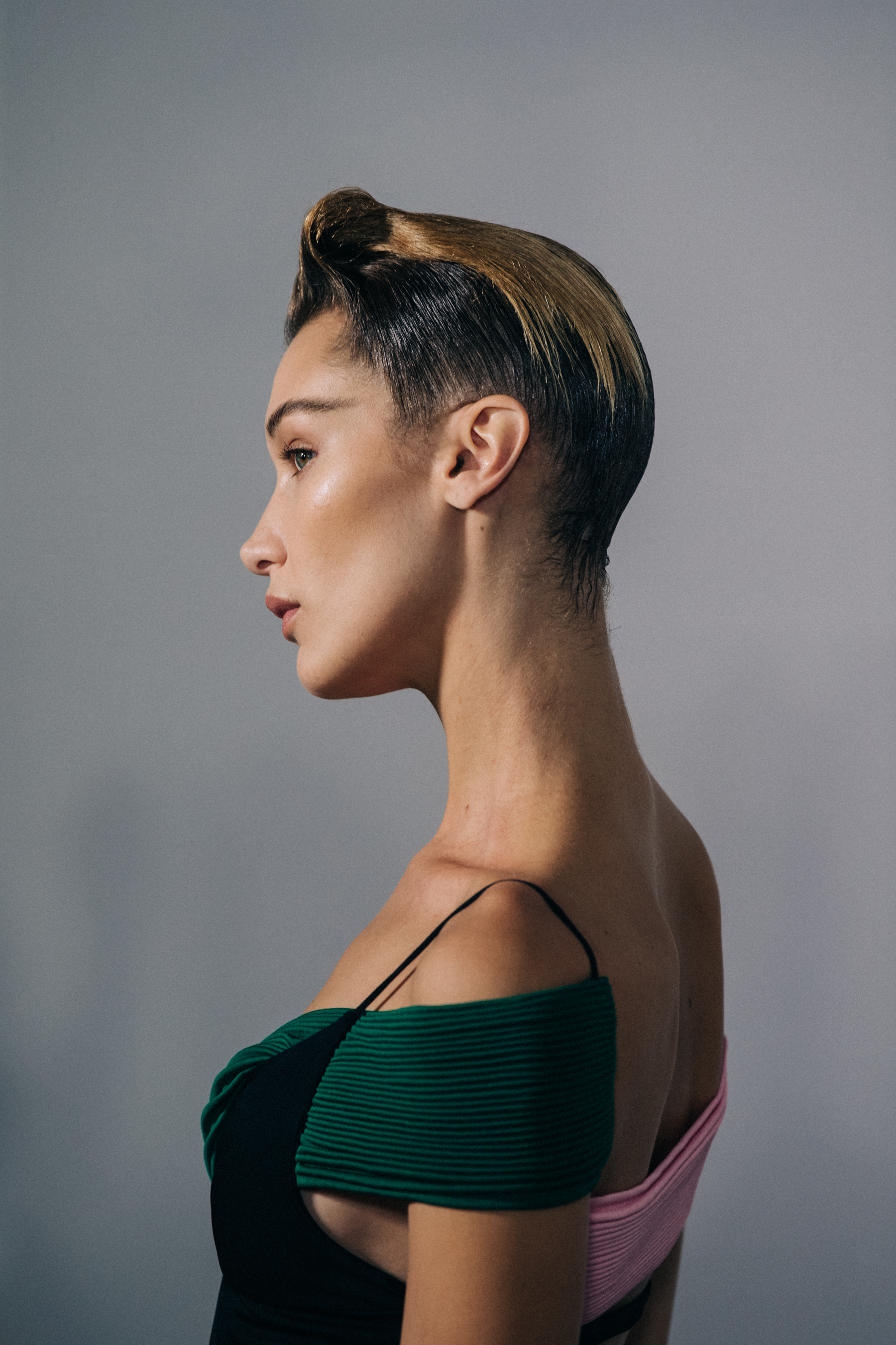 Model backstage wearing green dress