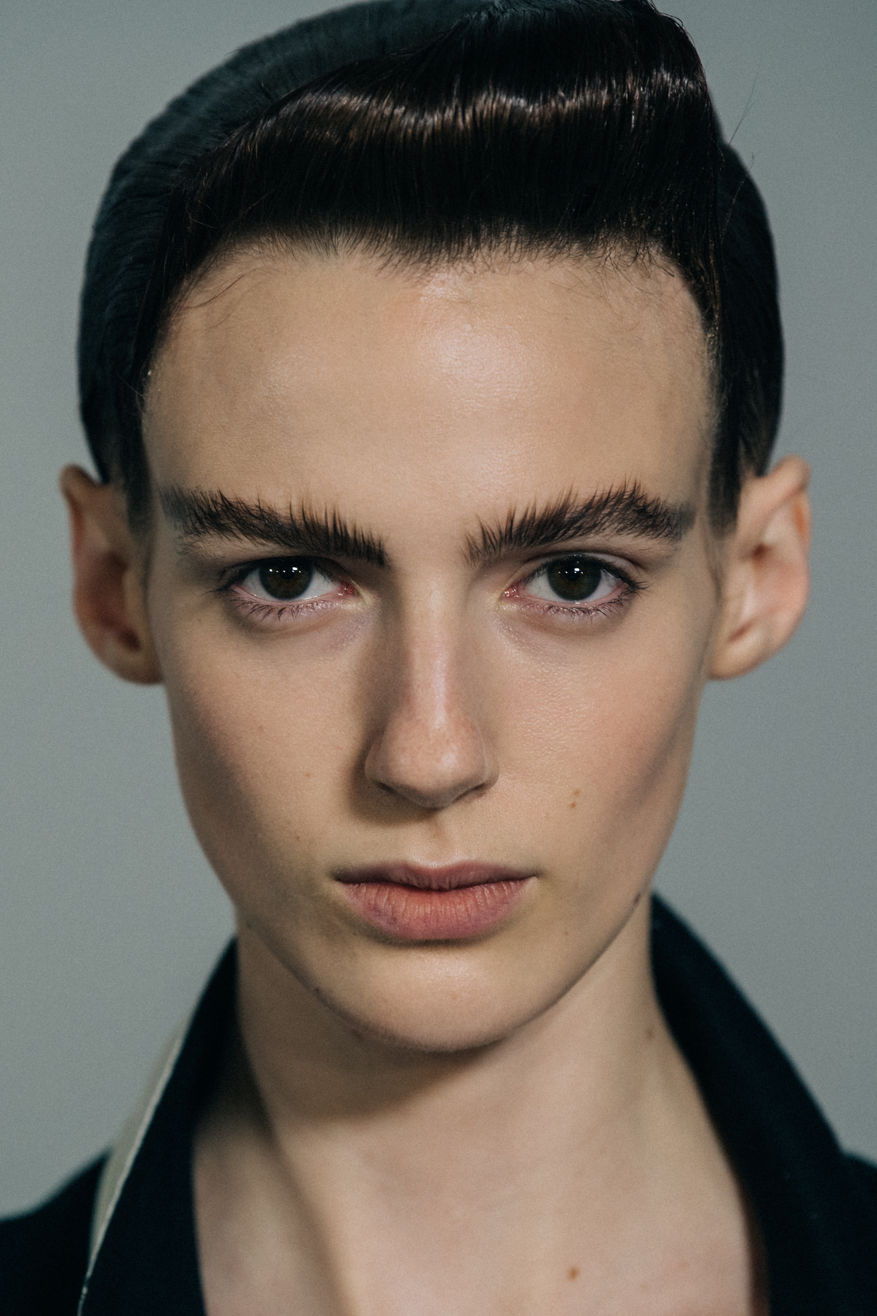Model with large eyebrows at Haider Ackermann