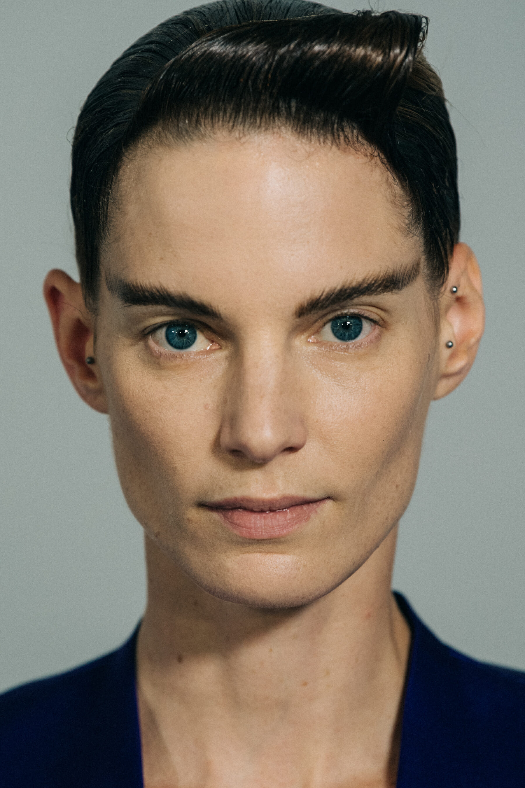 Model with large eyebrows at Haider Ackermann