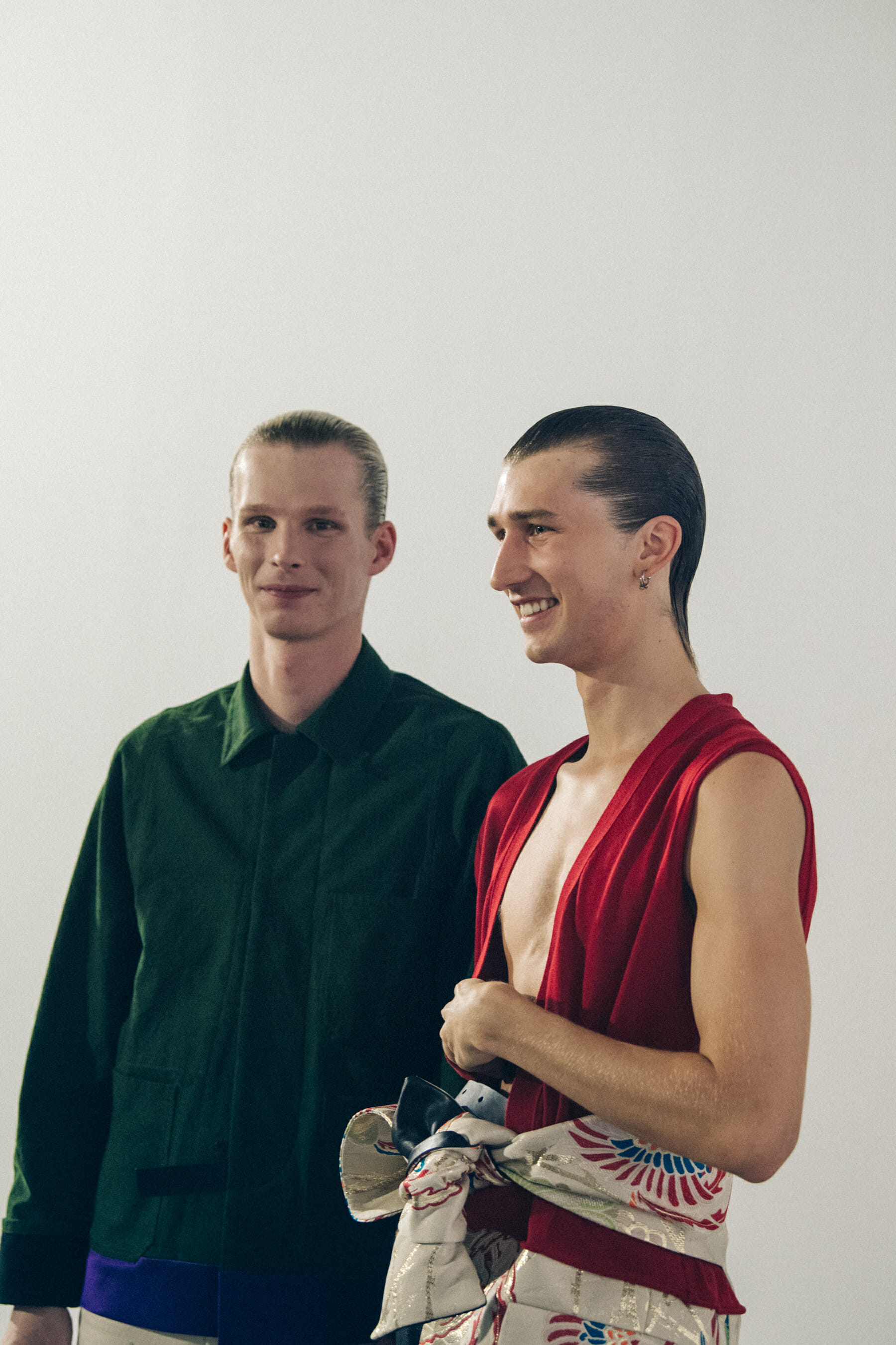 Model wearing green shirt backstage