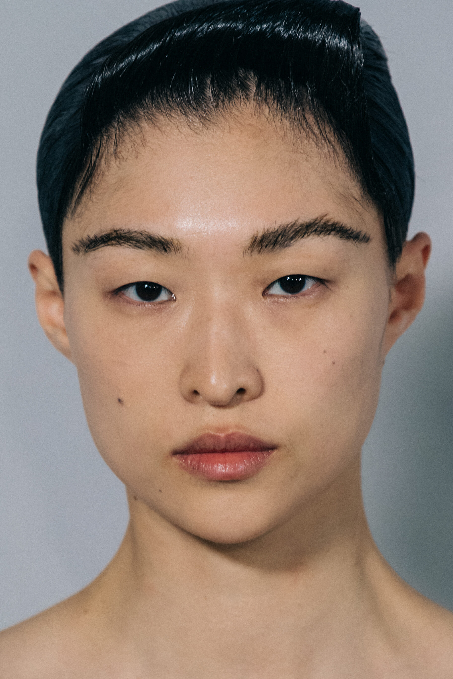Model wearing black dress at Haider Ackermann