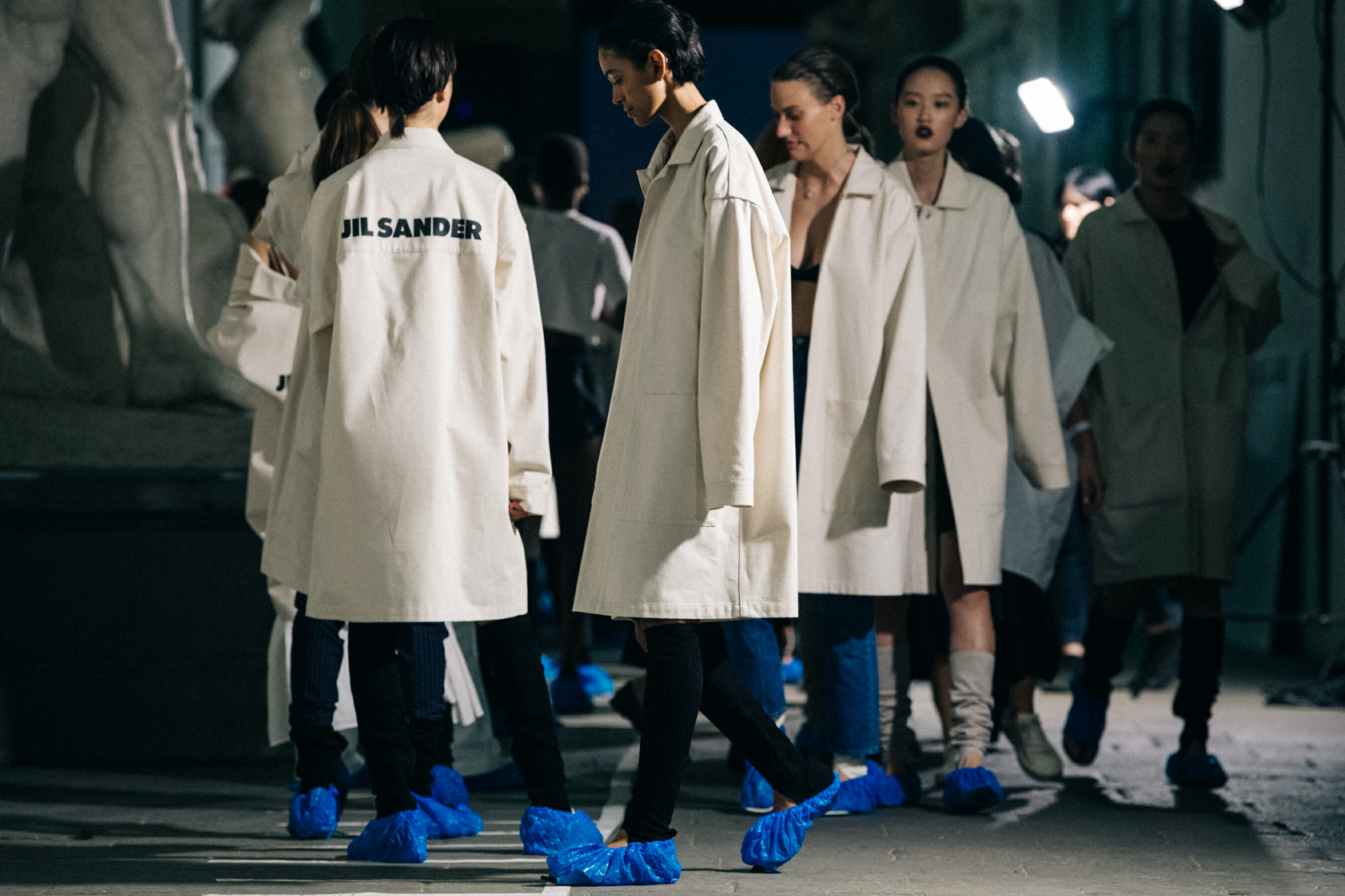 Models wearing white Jil Sander outfits
