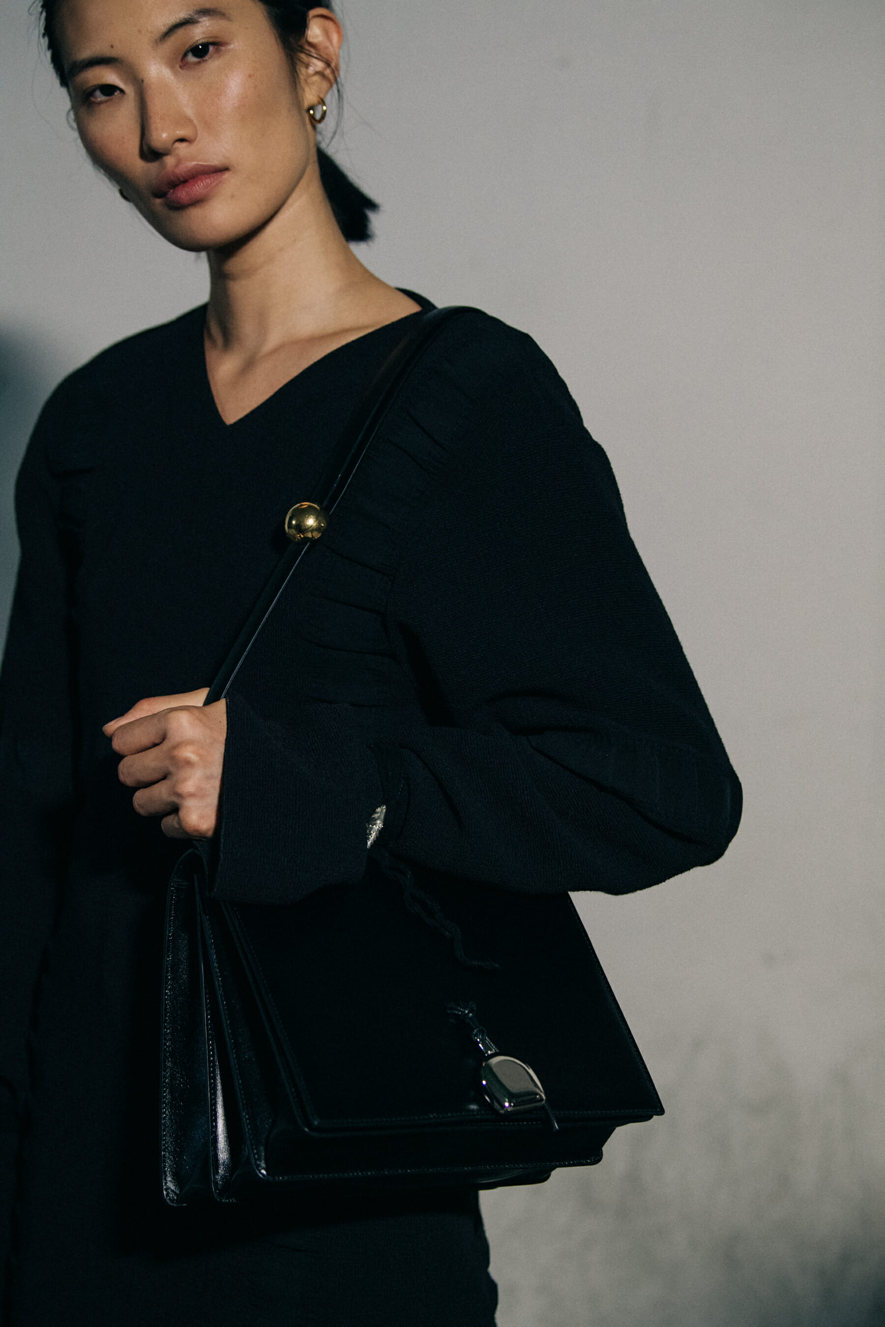 Models wearing black Jil Sander outfits