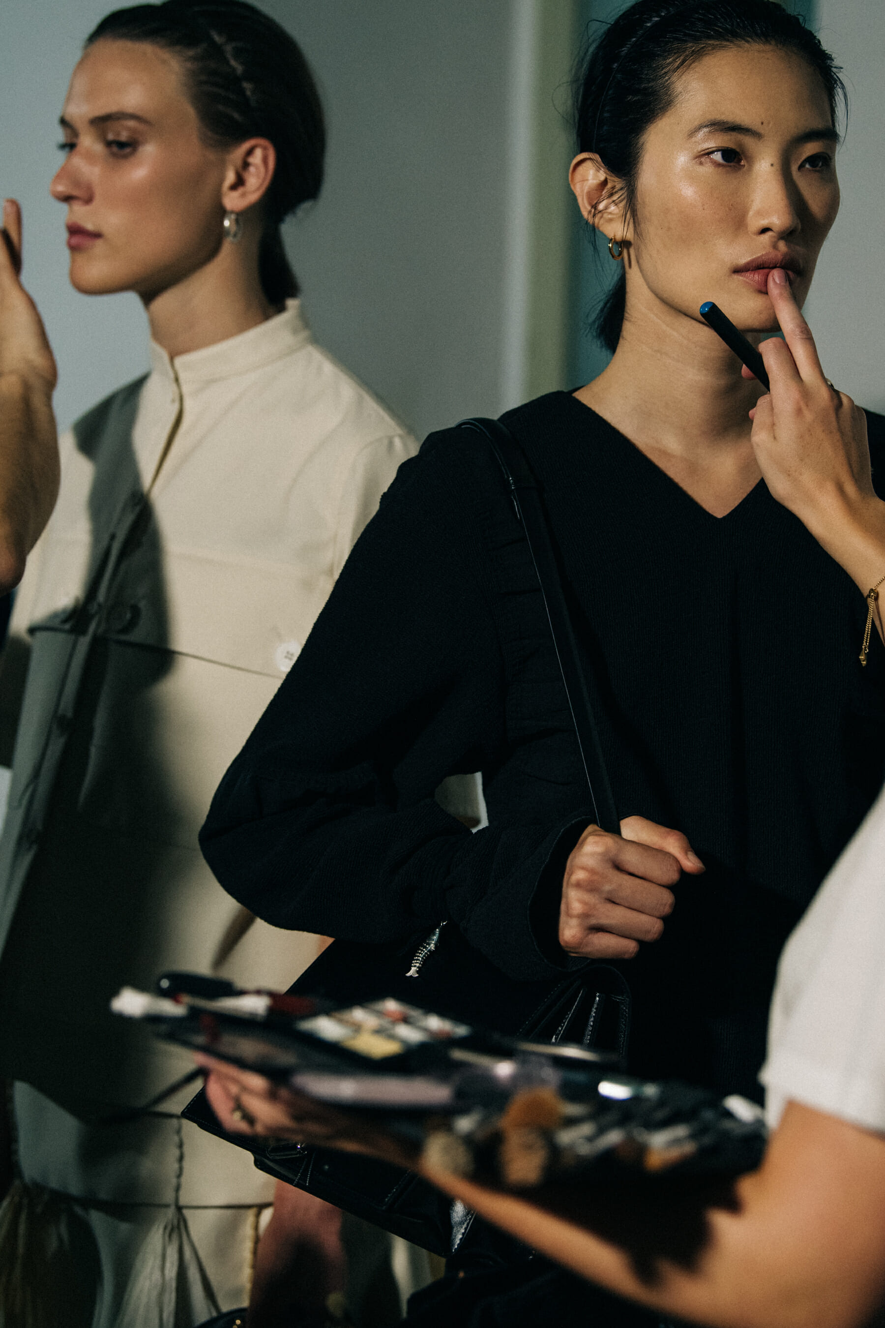 Models in hair and makeup at Jil Sander