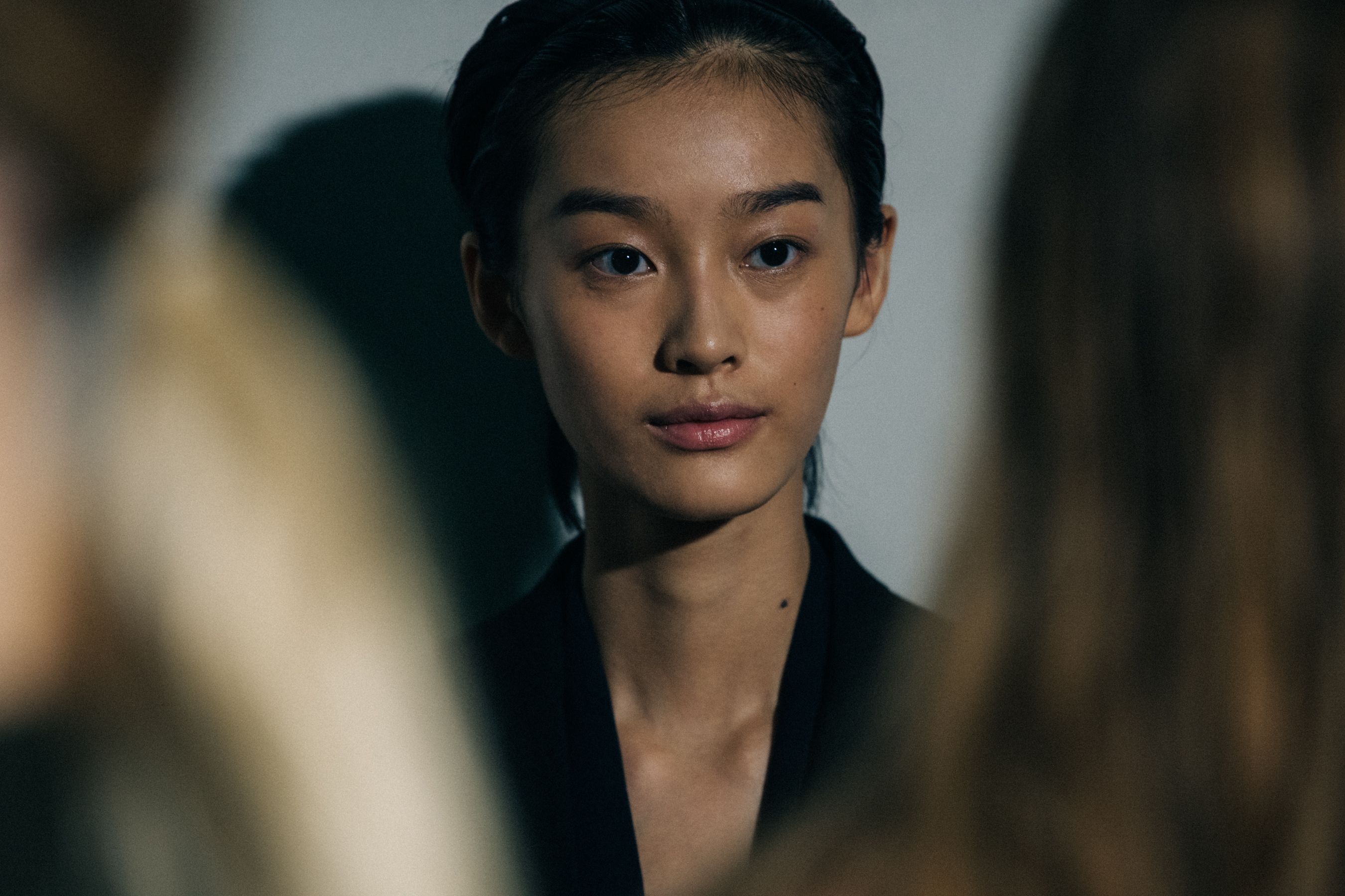 Models wearing black Jil Sander outfits