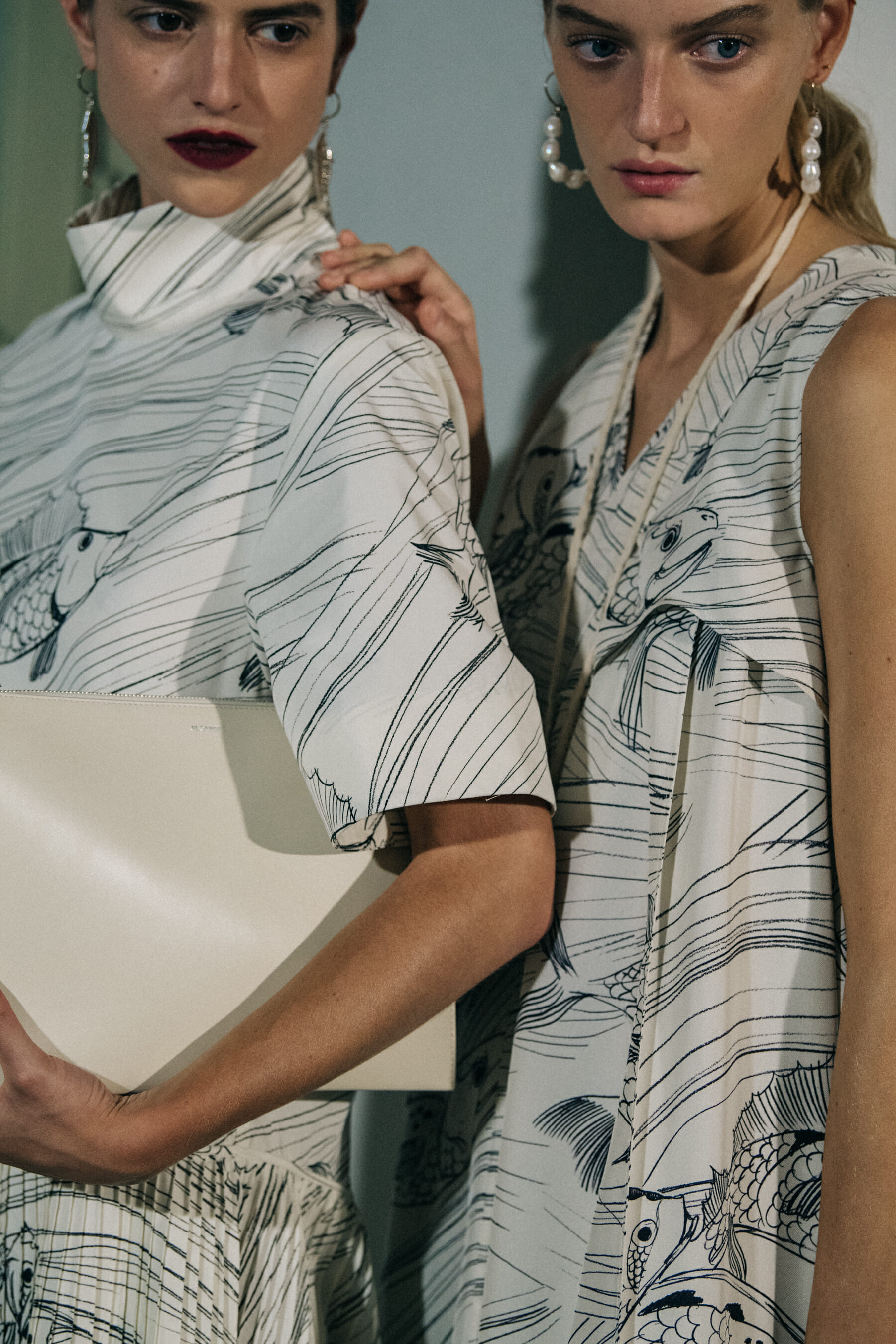 Models wearing white Jil Sander outfits