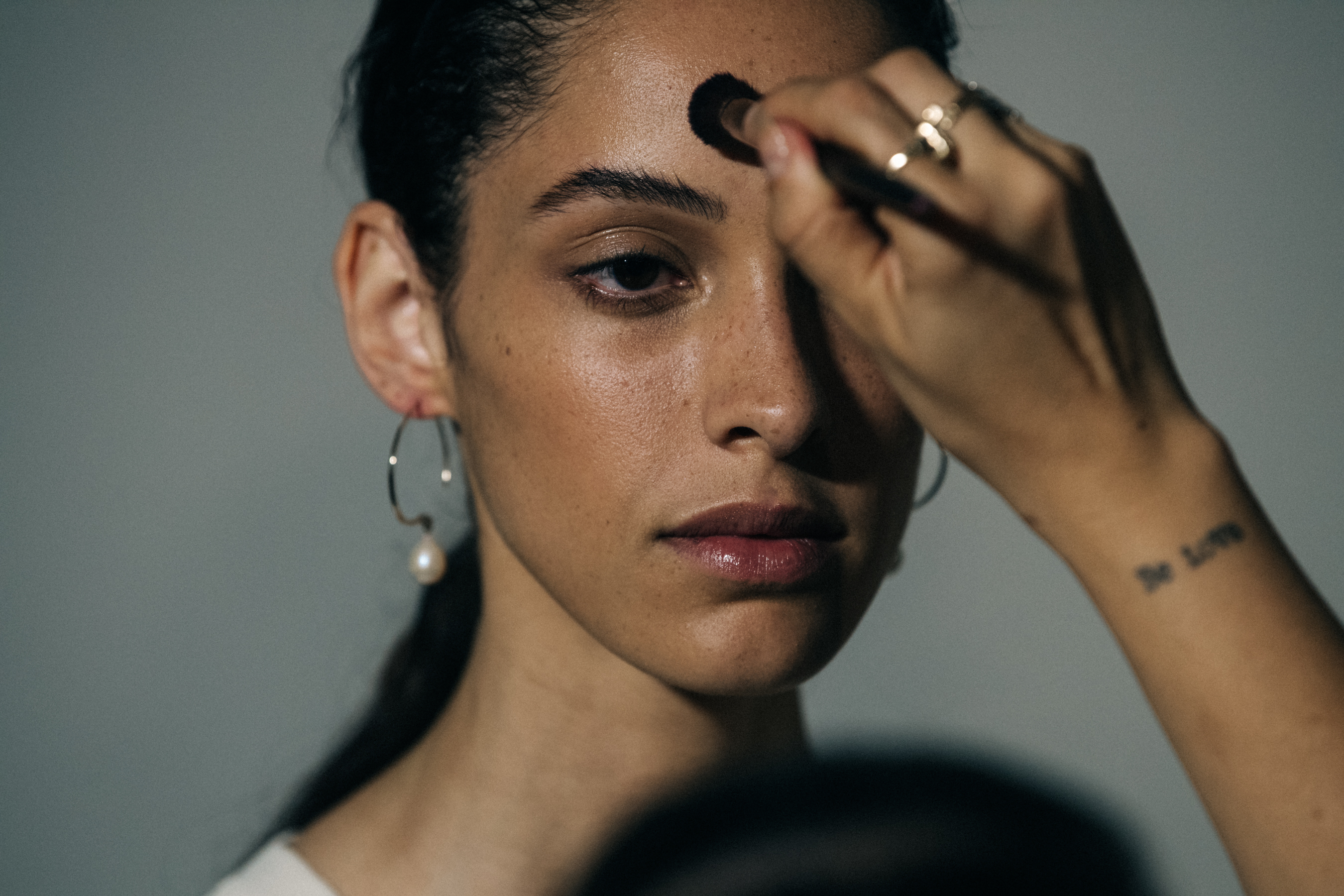 Models in hair and makeup at Jil Sander