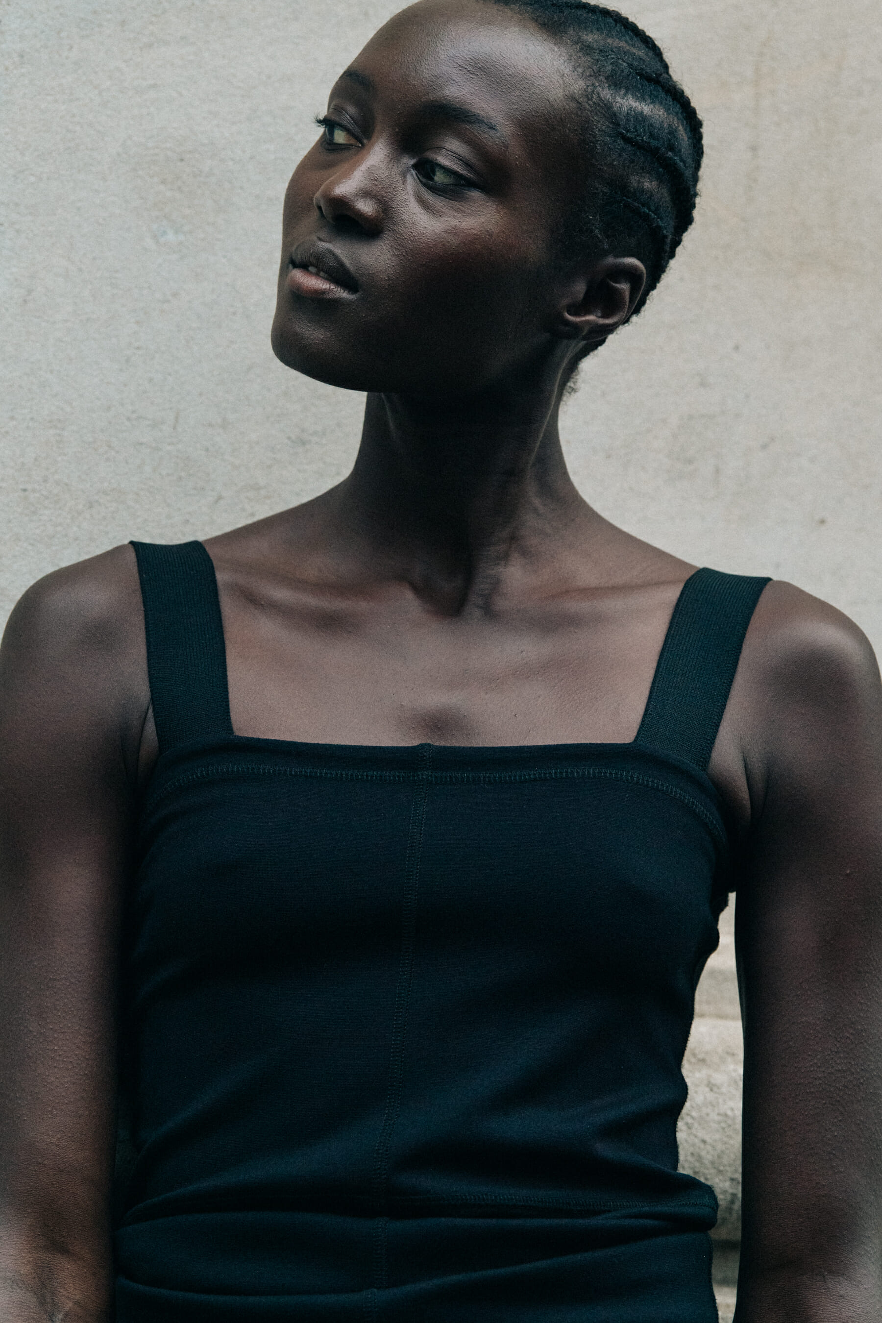 Model wearing black dress at Lemaire