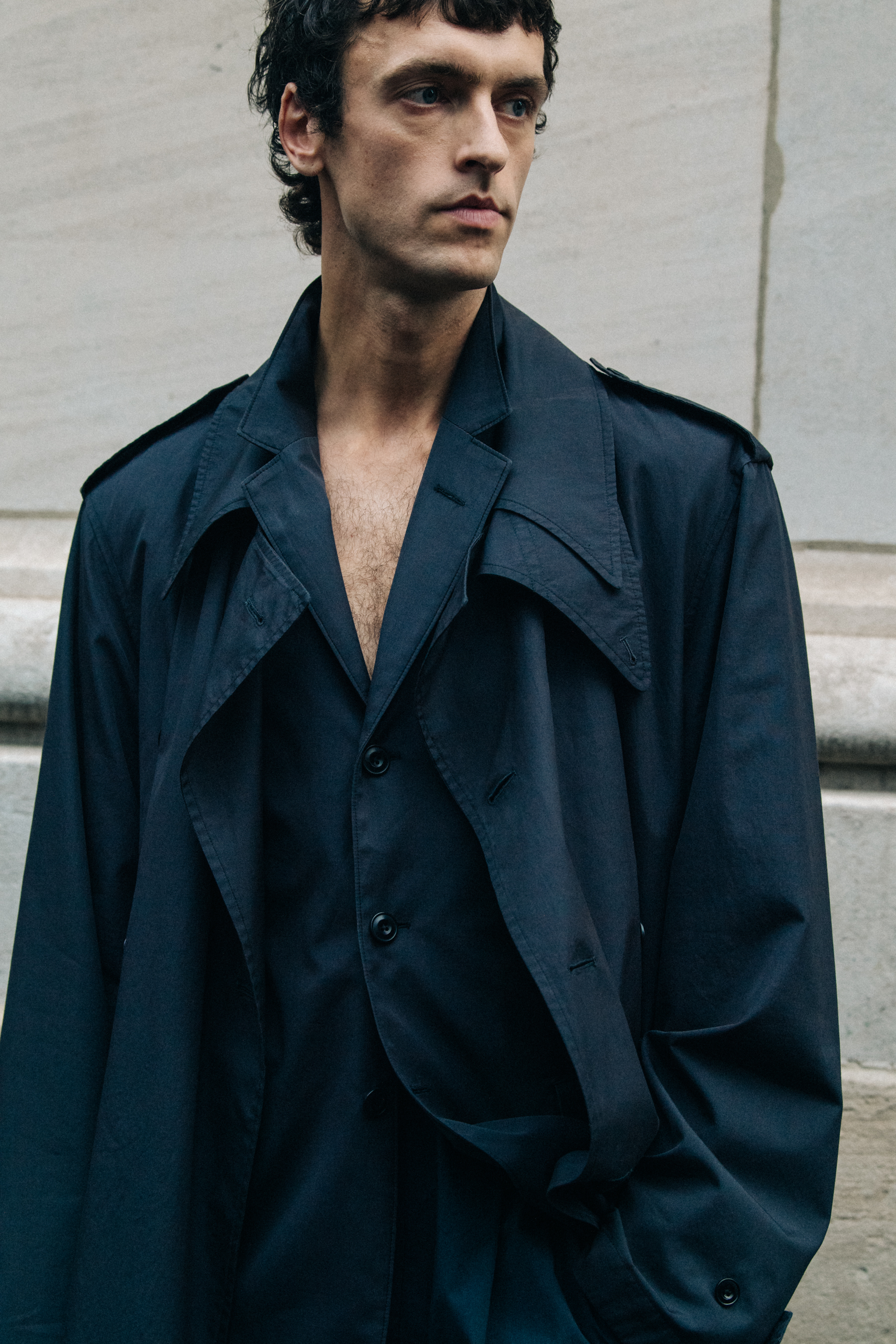 Model wearing dark suit at Lemaire