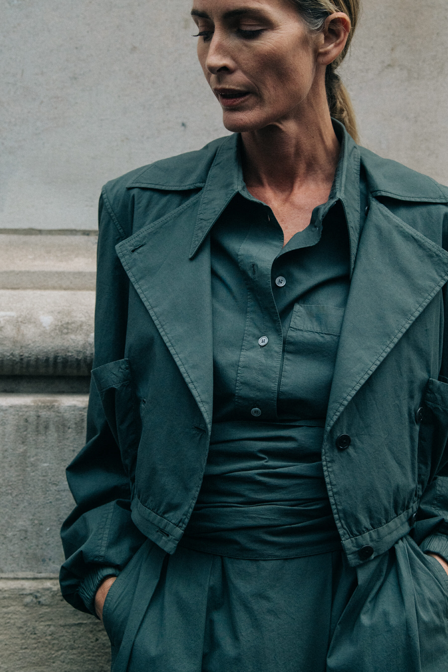 Model wearing green coat at Lemaire
