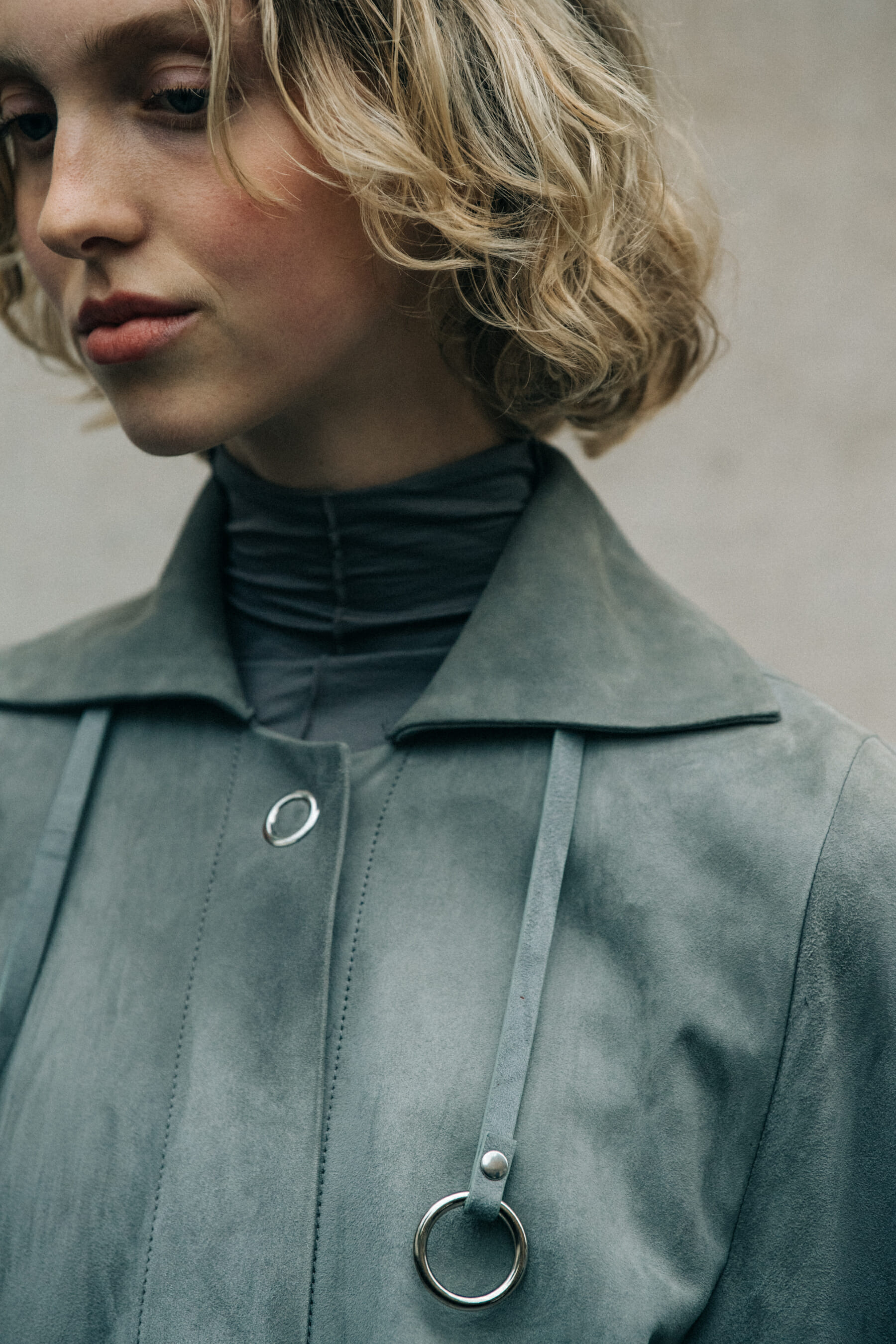 Model wearing grey outfit at Lemaire