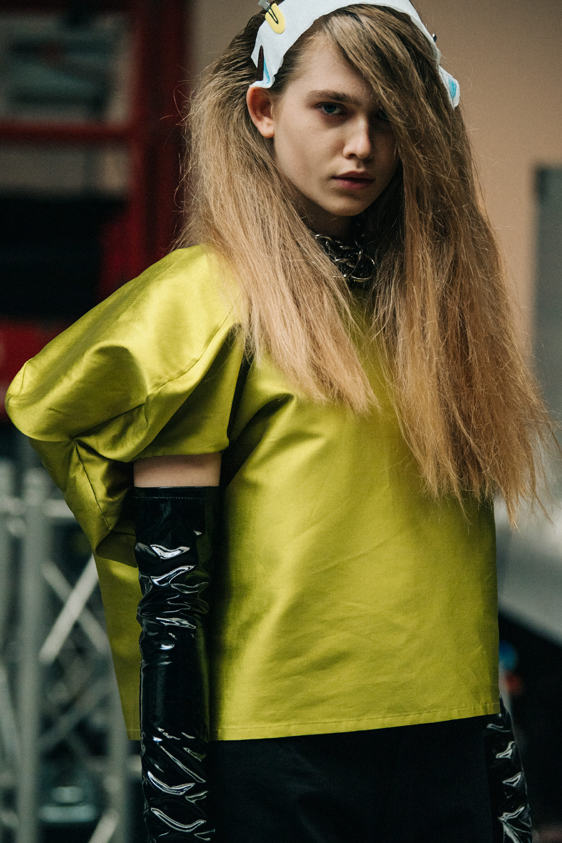 Model wearing green backstage at Marques Almeida