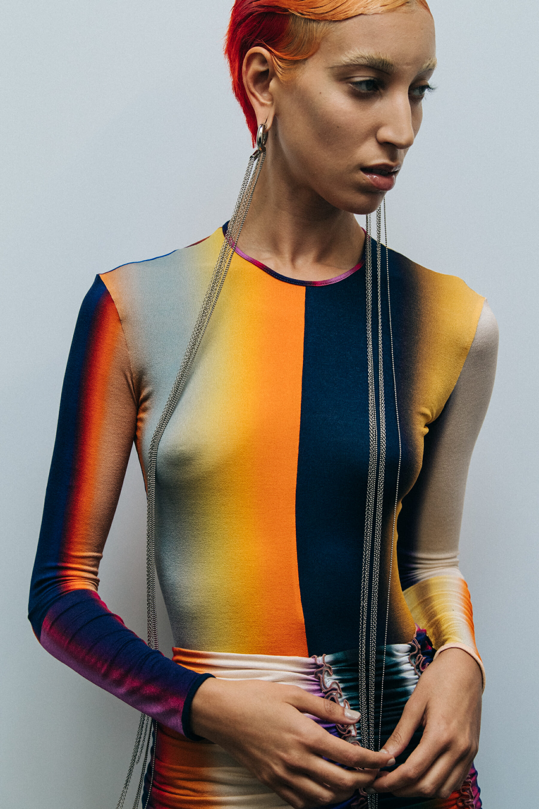 Model wearing striped Mugler outfit