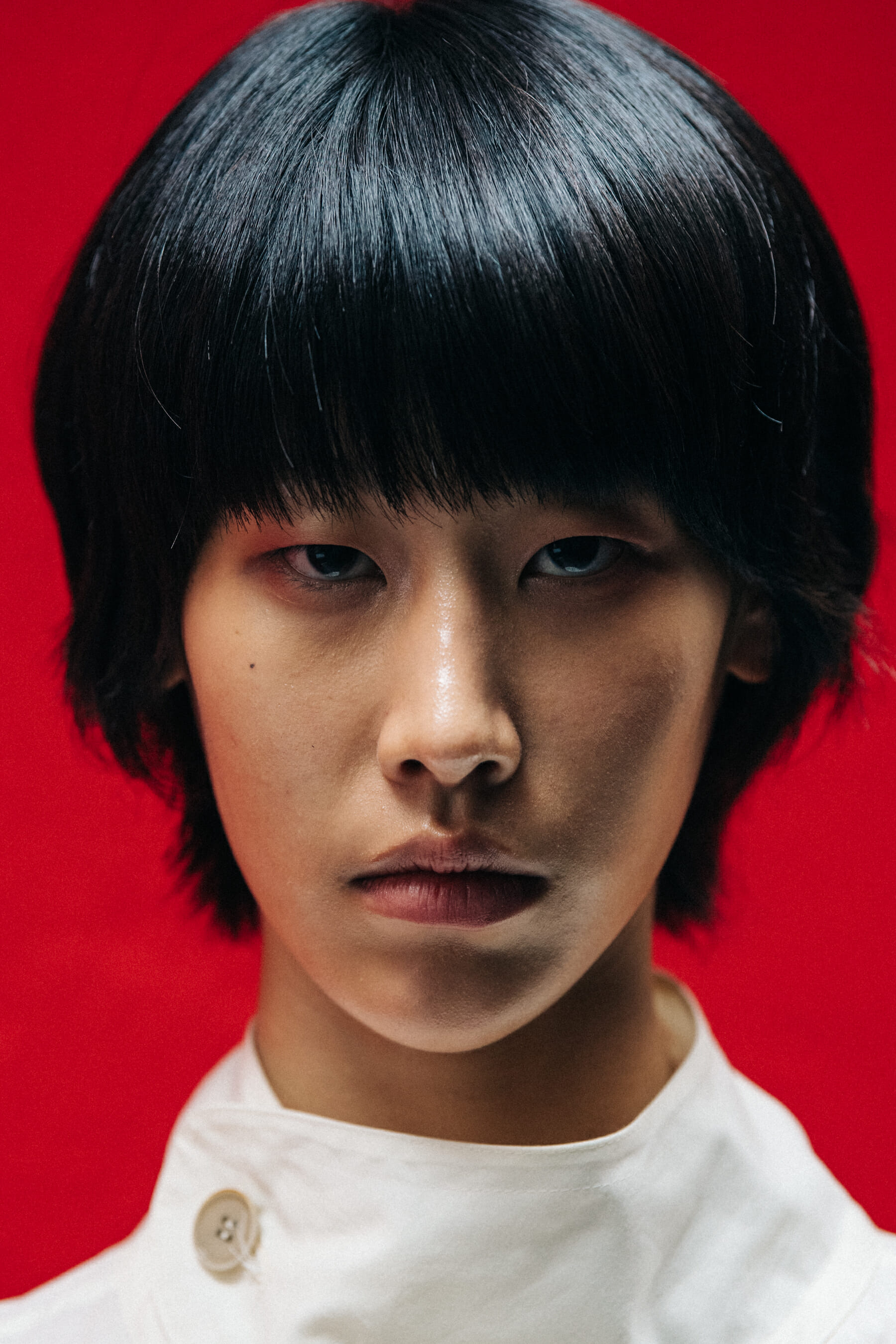 Portrait of model against red wall