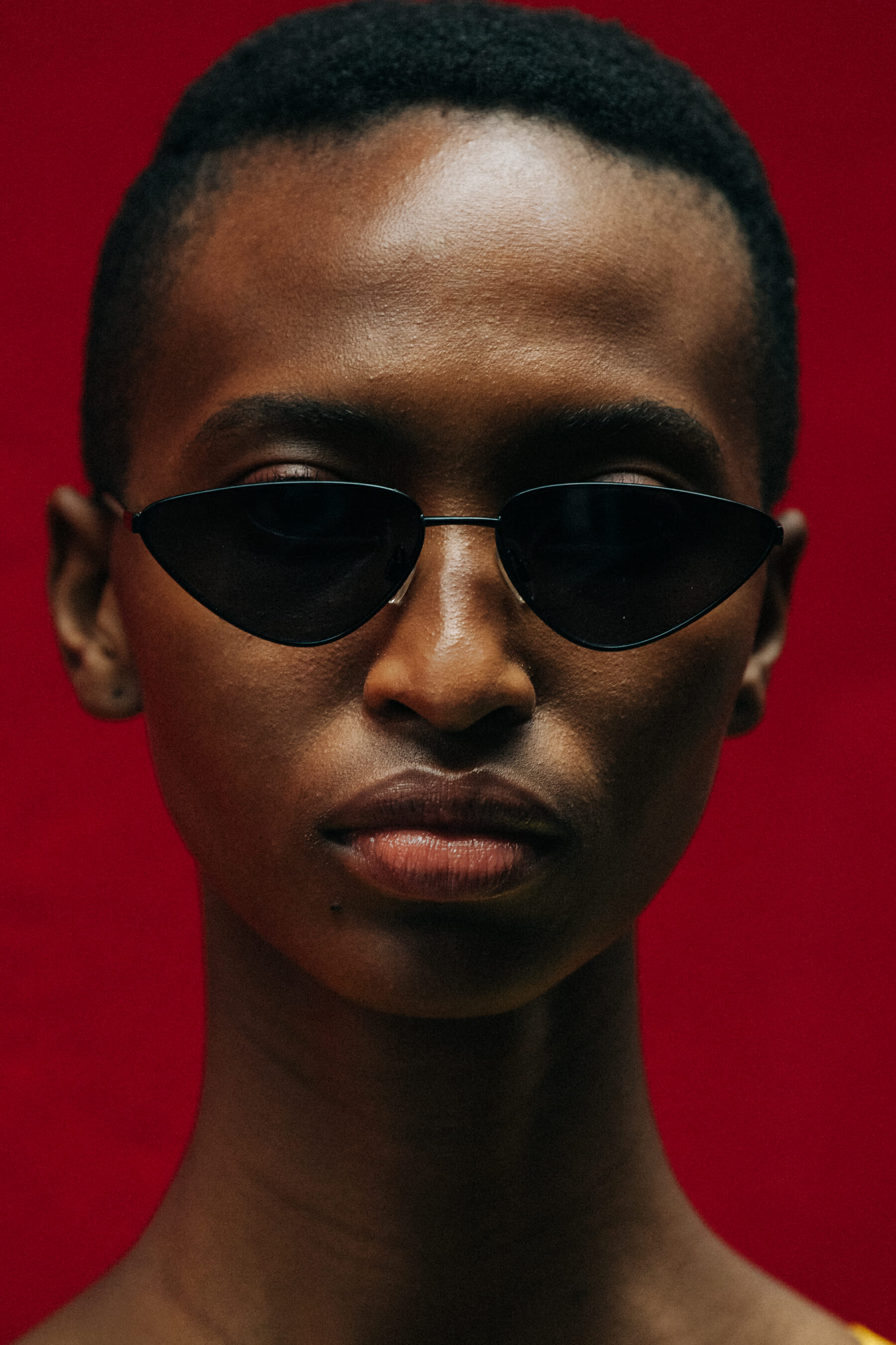 Portrait of model against red wall