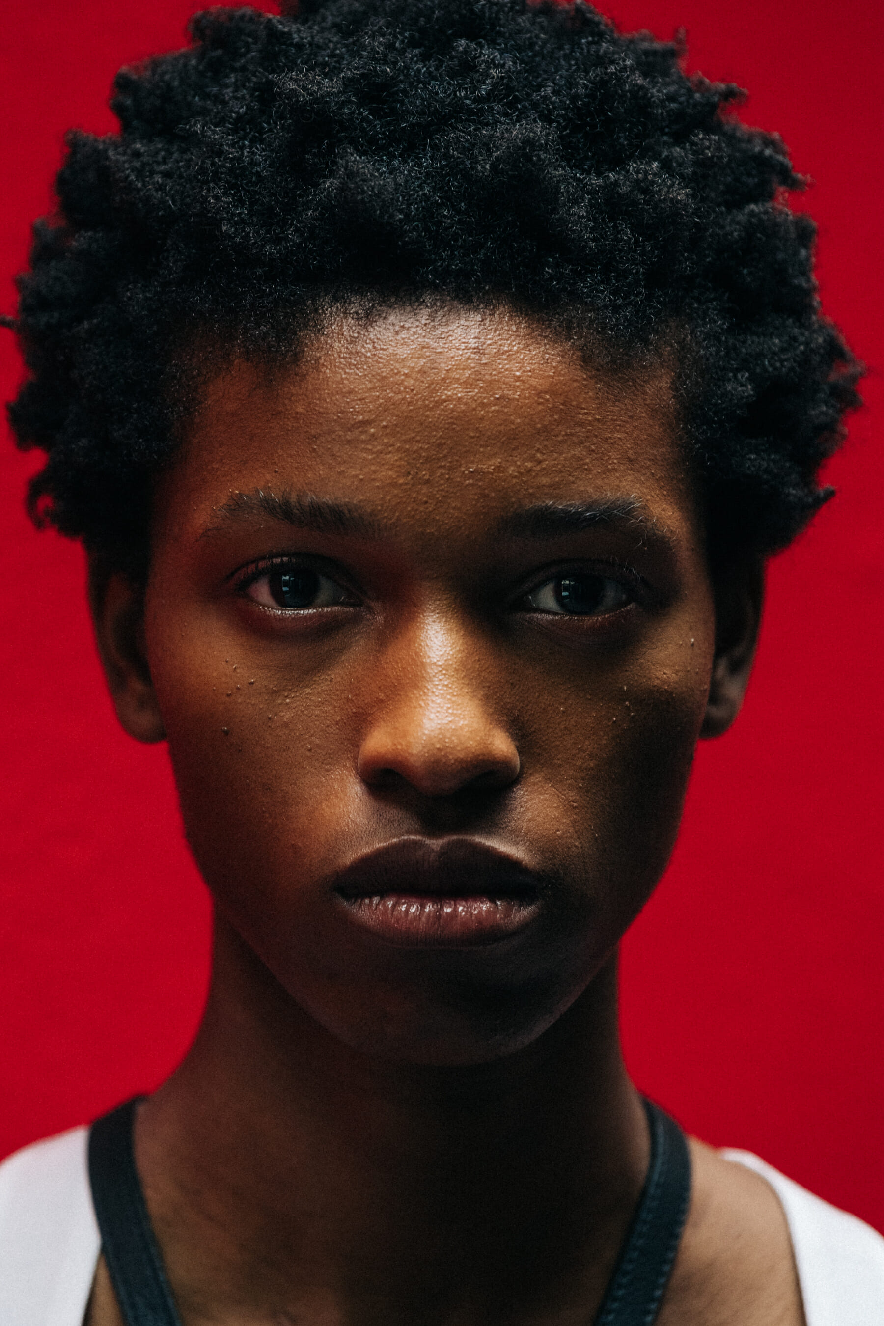 Portrait of model against red wall