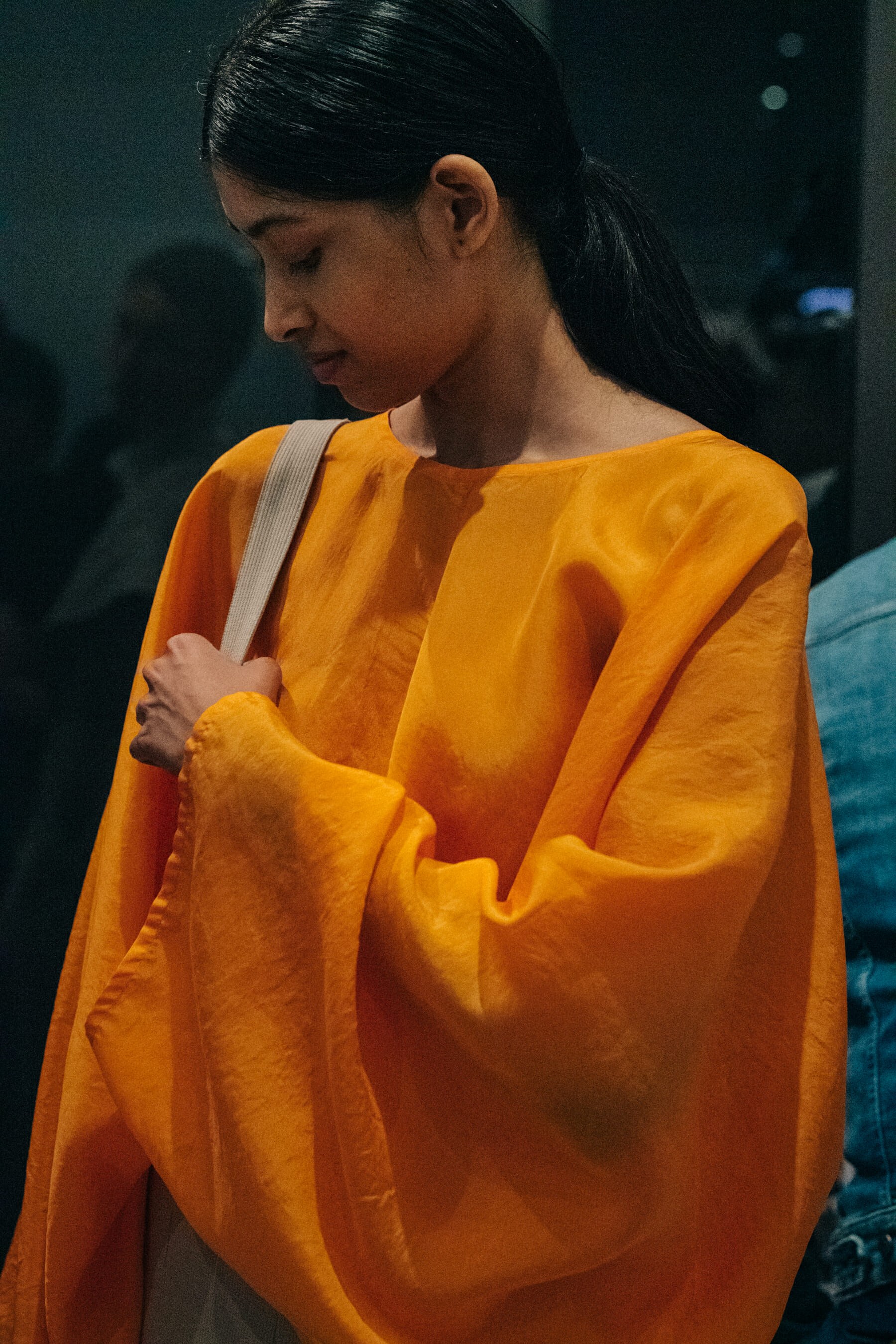 Model wearing orange outfit at Nehera